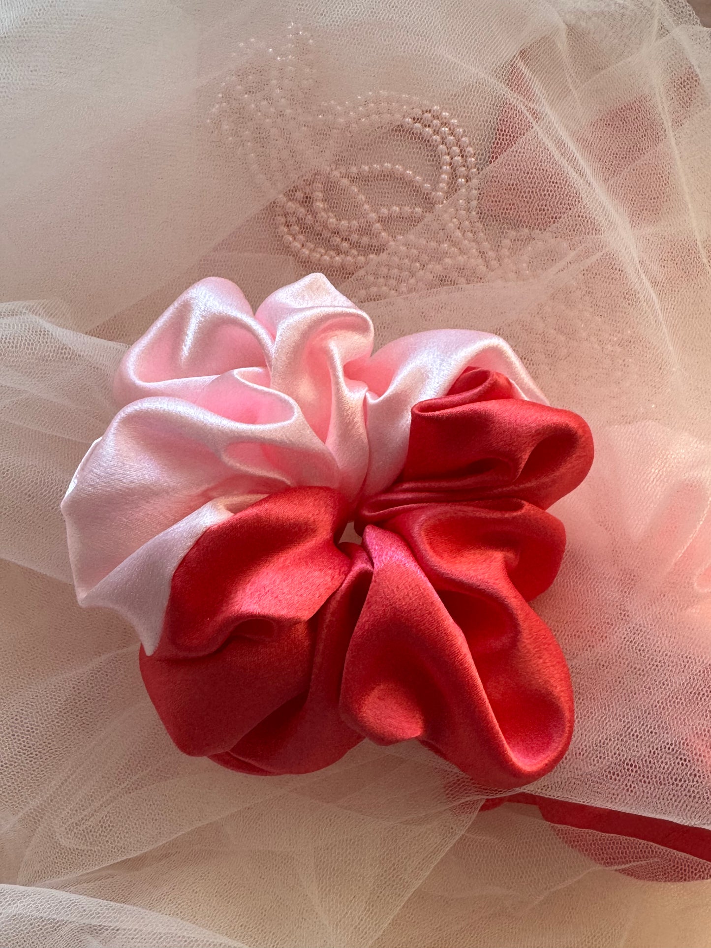 Single Scrunchy outlining the beautiful light and dark pink shades displayed with both colors
