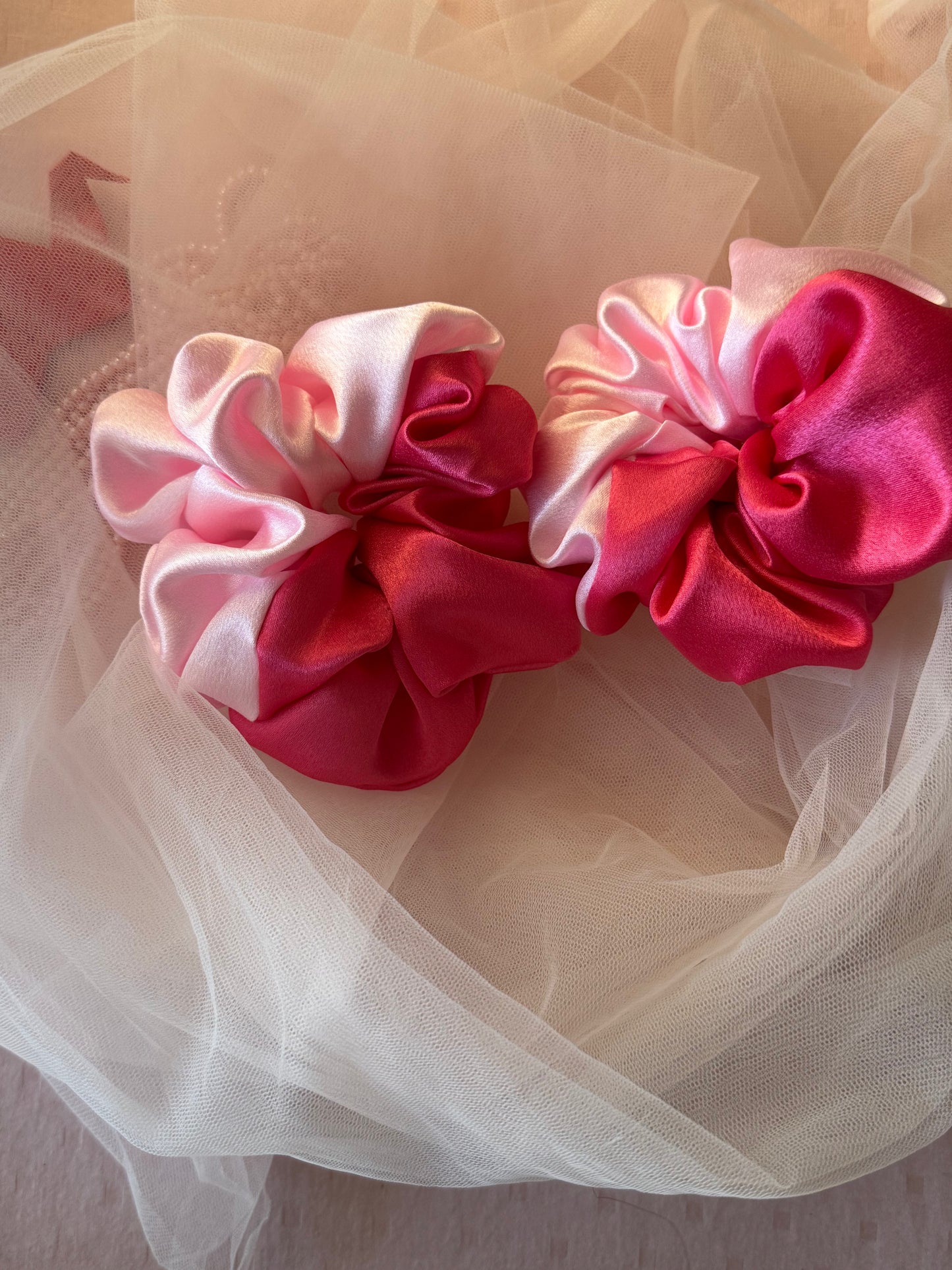 Two Scrunchies outlining the beautiful light and dark pink shades displayed with both colors Horizontally kept