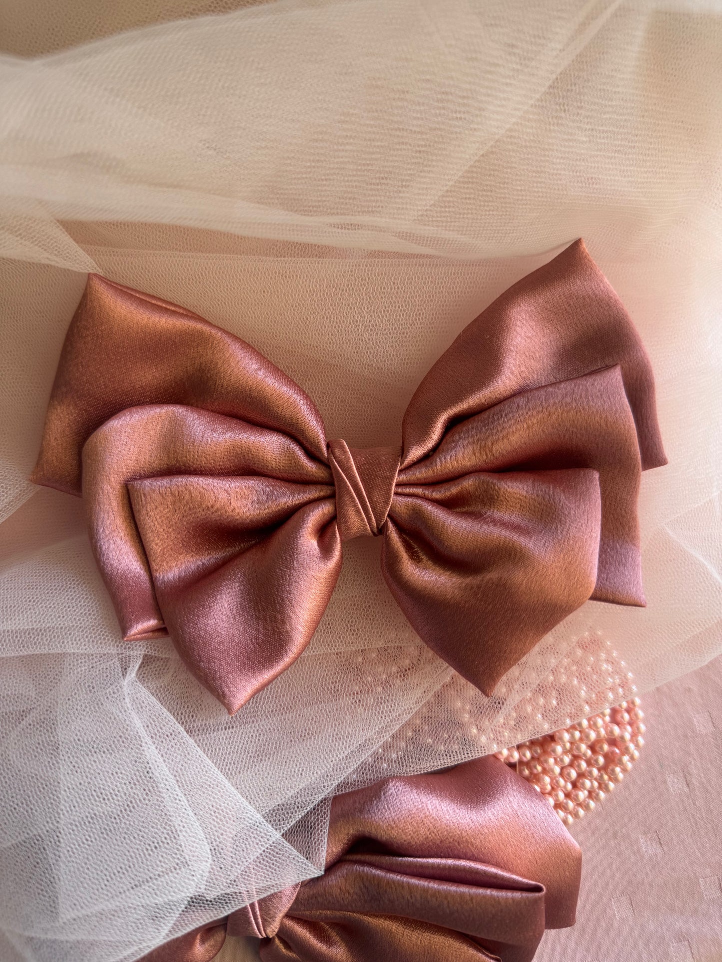 Two Satin Hair bows with Clip Front Size, beautiful metallic Peach Color, with Props one horizontal, one partly shown