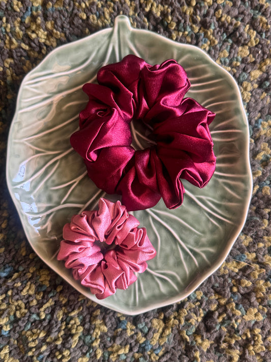 Set of two Pink-O Fuzz Satin Scrunchies – premium large and small scrunchies in dark fuchsia and light pink, displayed front-facing in a straight alignment