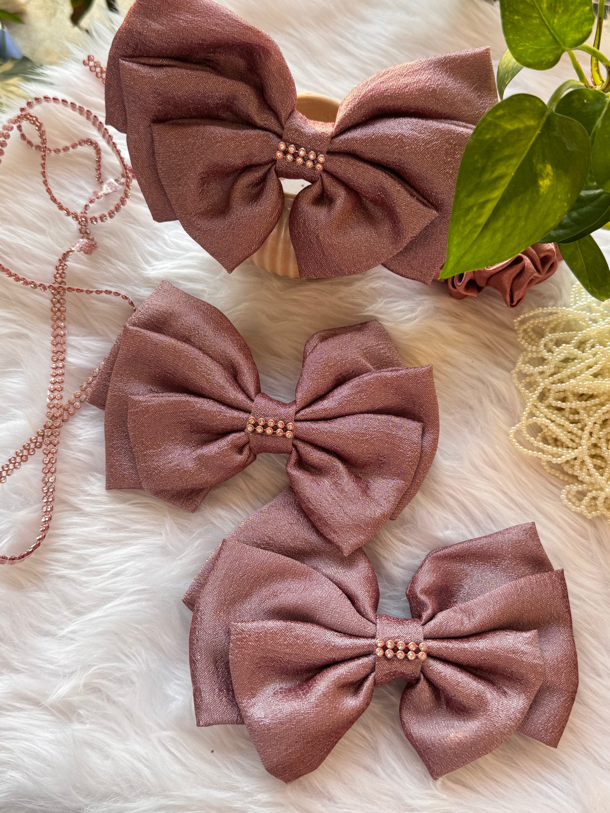 Collection of Rose Gold Satin Hair Bows – stylish Vichitra silk hair accessories with stone detailing, neatly arranged front-facing
