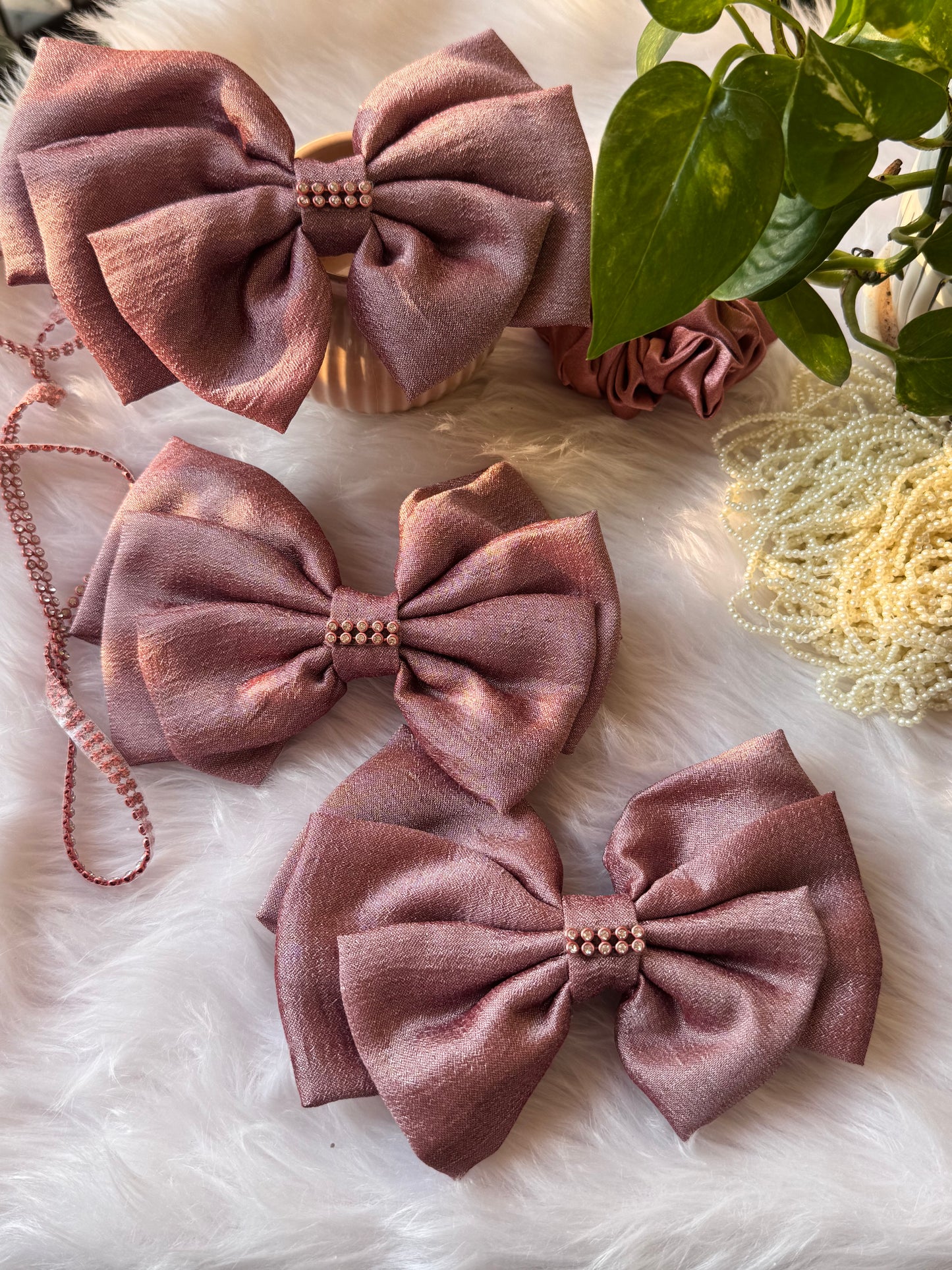 Collection of Rose Gold Satin Hair Bows – stylish Vichitra silk hair accessories with stone detailing, neatly arranged front-facing