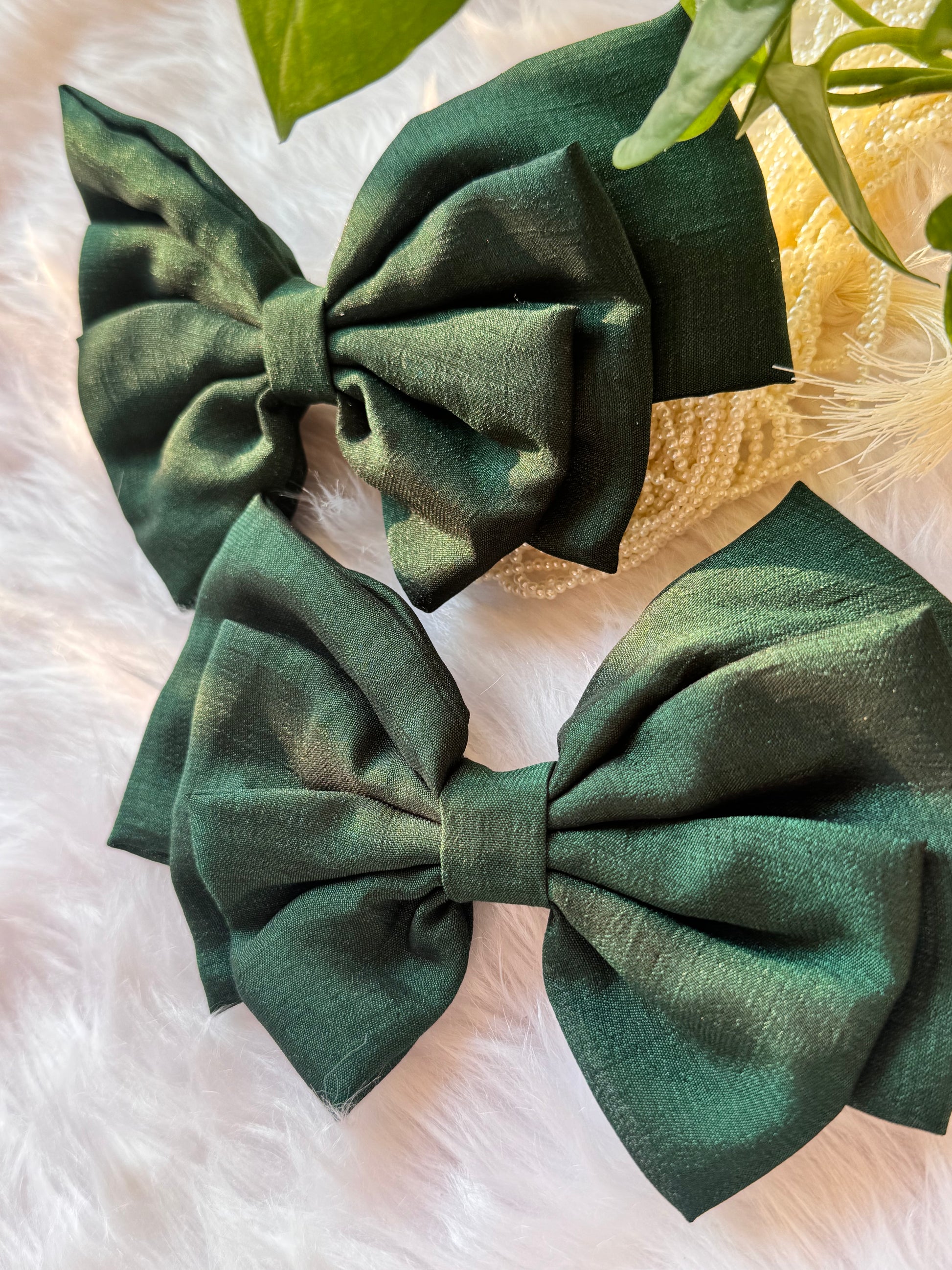 Collection of Forrest Green Vichitra Silk Hair Bows – elegant bottle green hair accessories neatly arranged front-facing.
