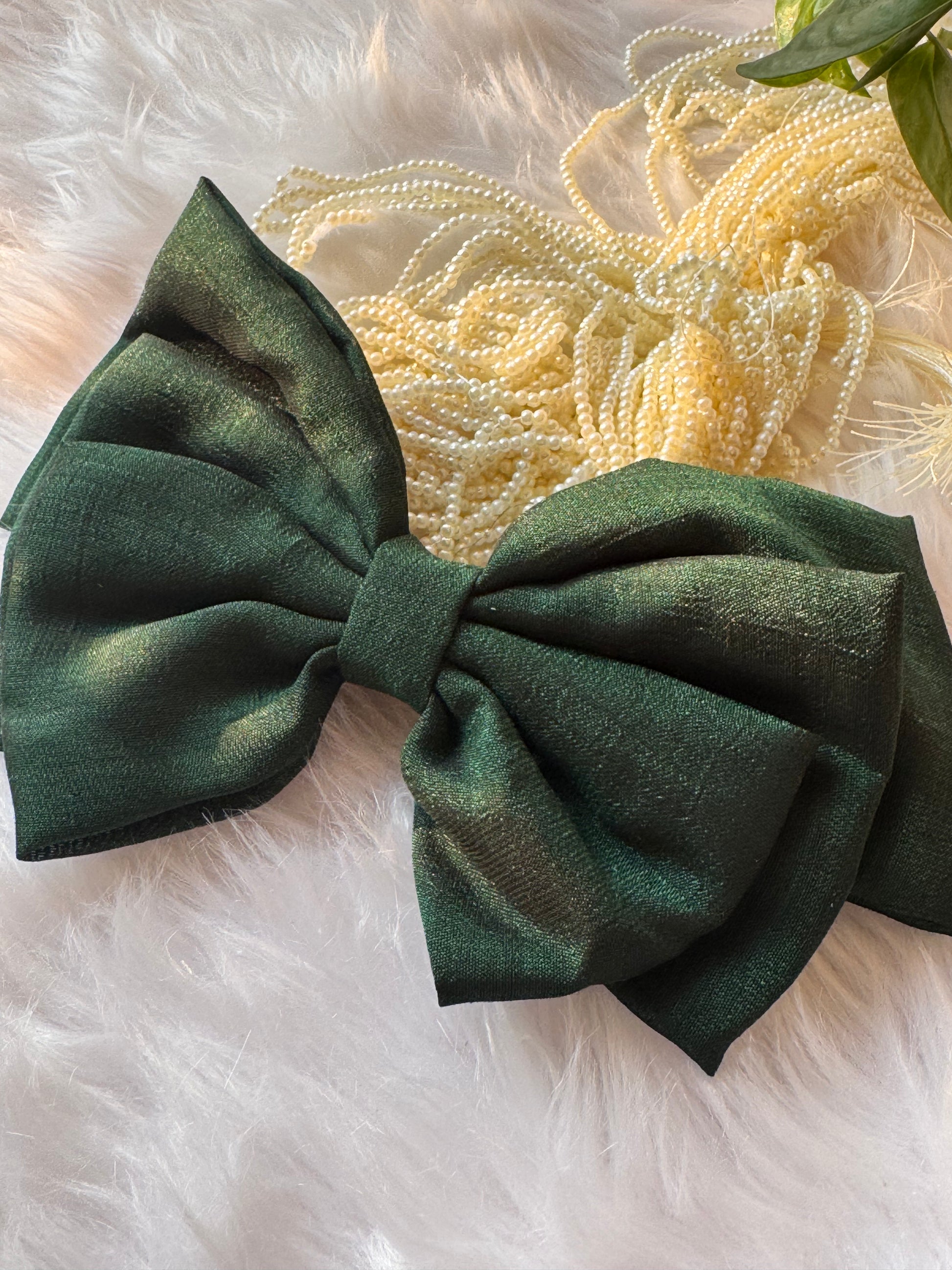 Forrest Green Vichitra Silk Hair Bow – luxurious bottle green hair accessory displayed front-facing in a straight position.