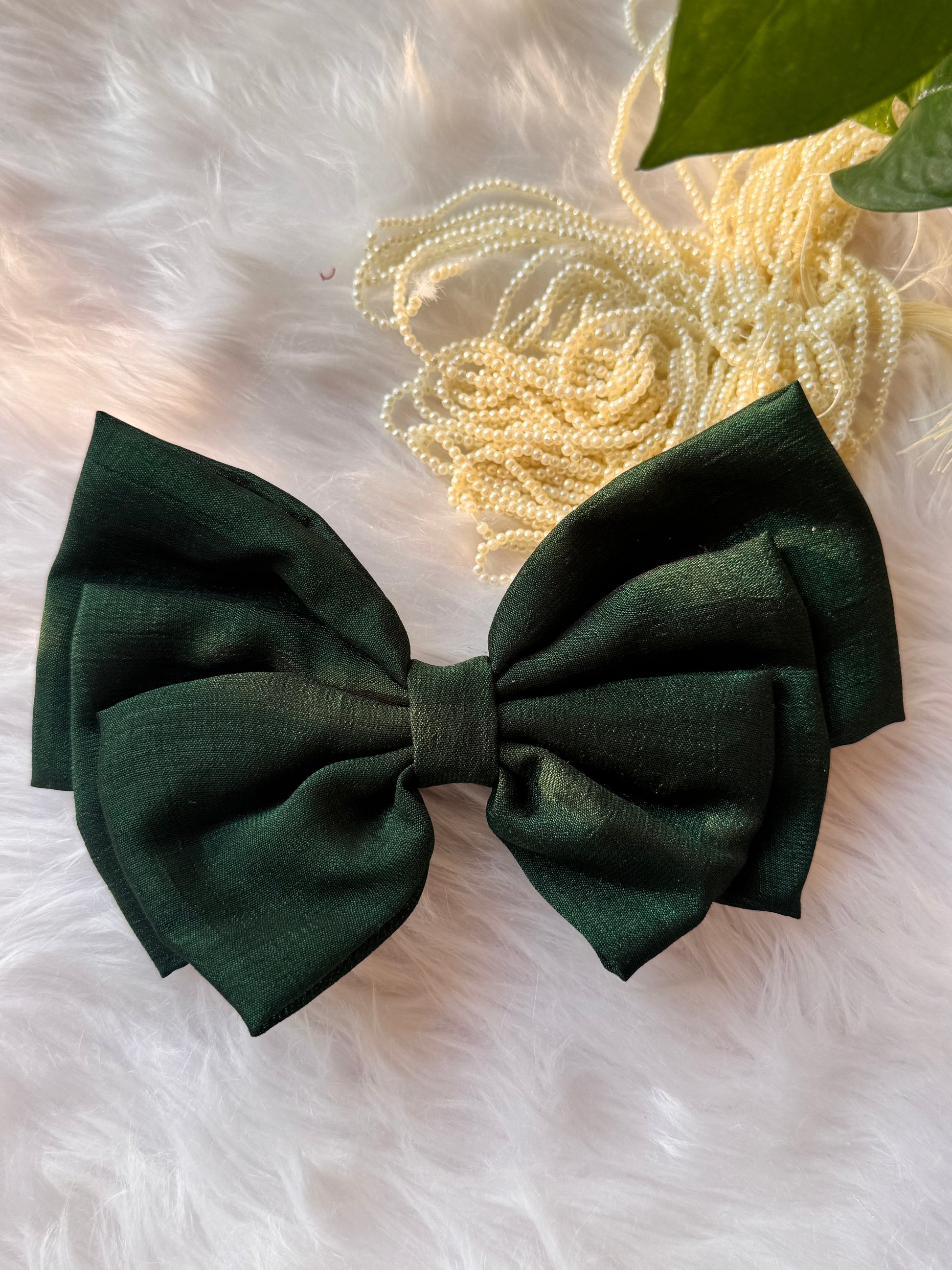 Forrest Green Vichitra Silk Hair Bow – luxurious bottle green hair accessory displayed front-facing in a straight position.