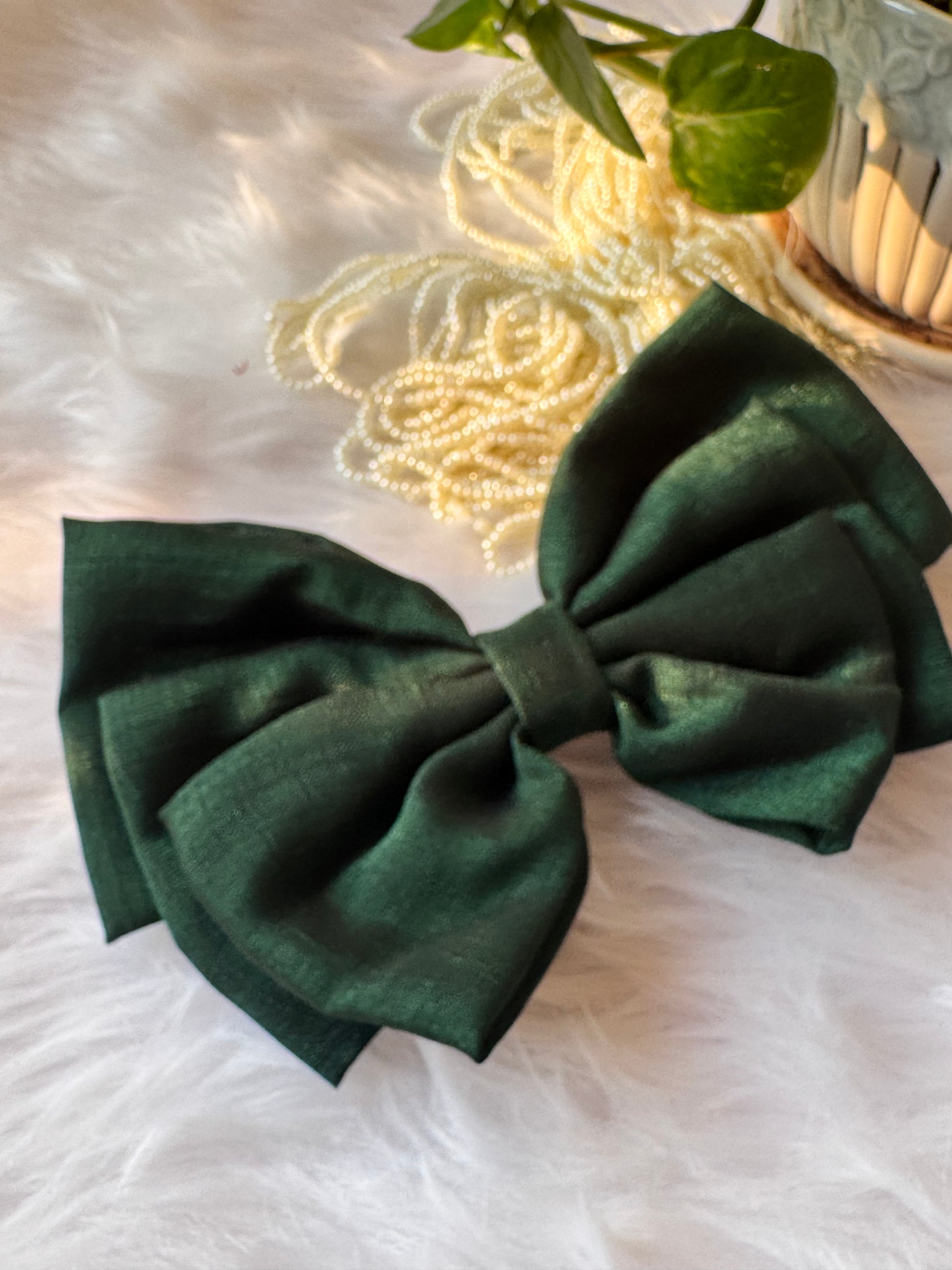 Forrest Green Vichitra Silk Hair Bow – luxurious bottle green hair accessory displayed front-facing in a straight position.