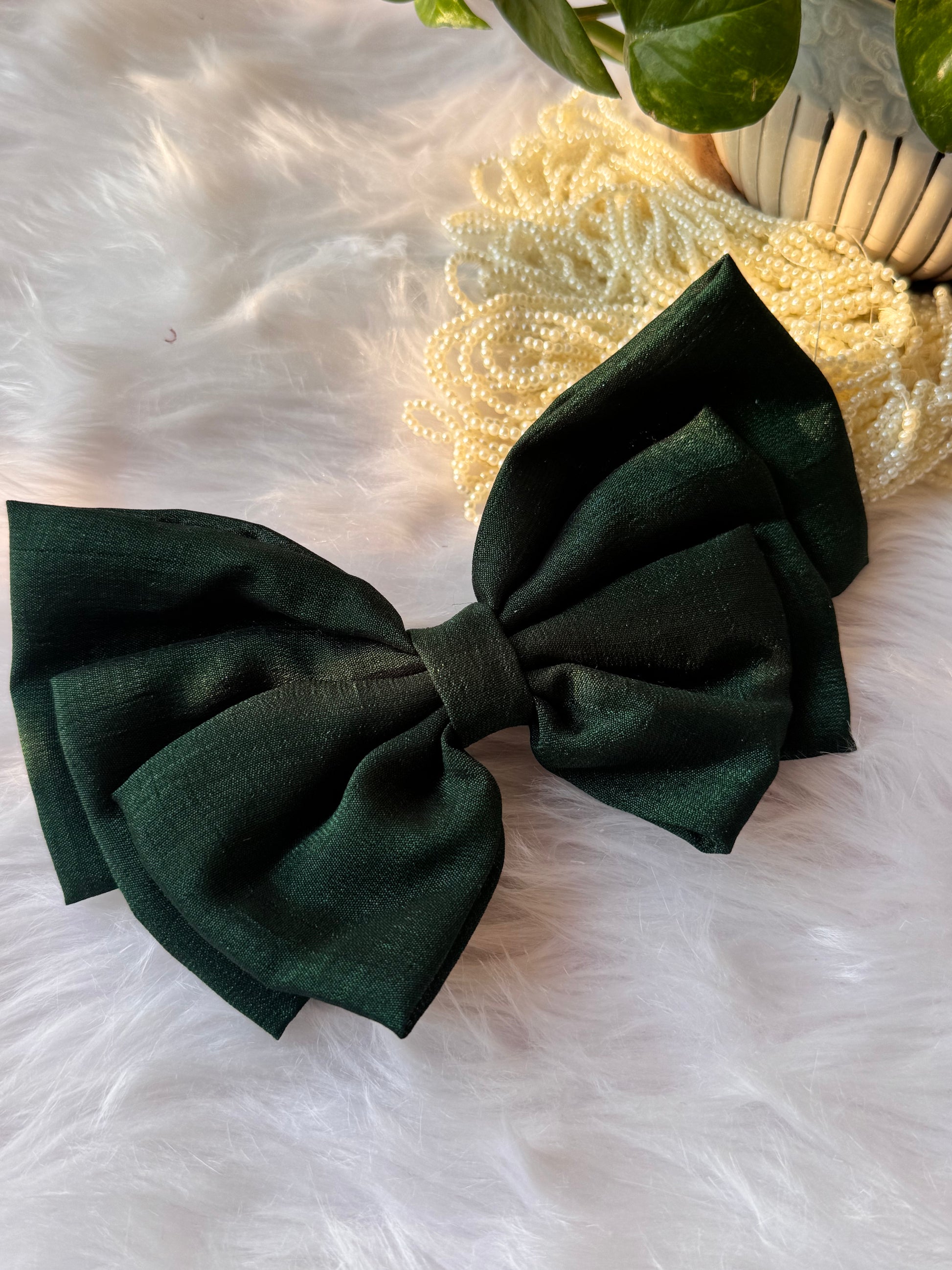 Forrest Green Vichitra Silk Hair Bow – luxurious bottle green hair accessory displayed front-facing in a straight position.