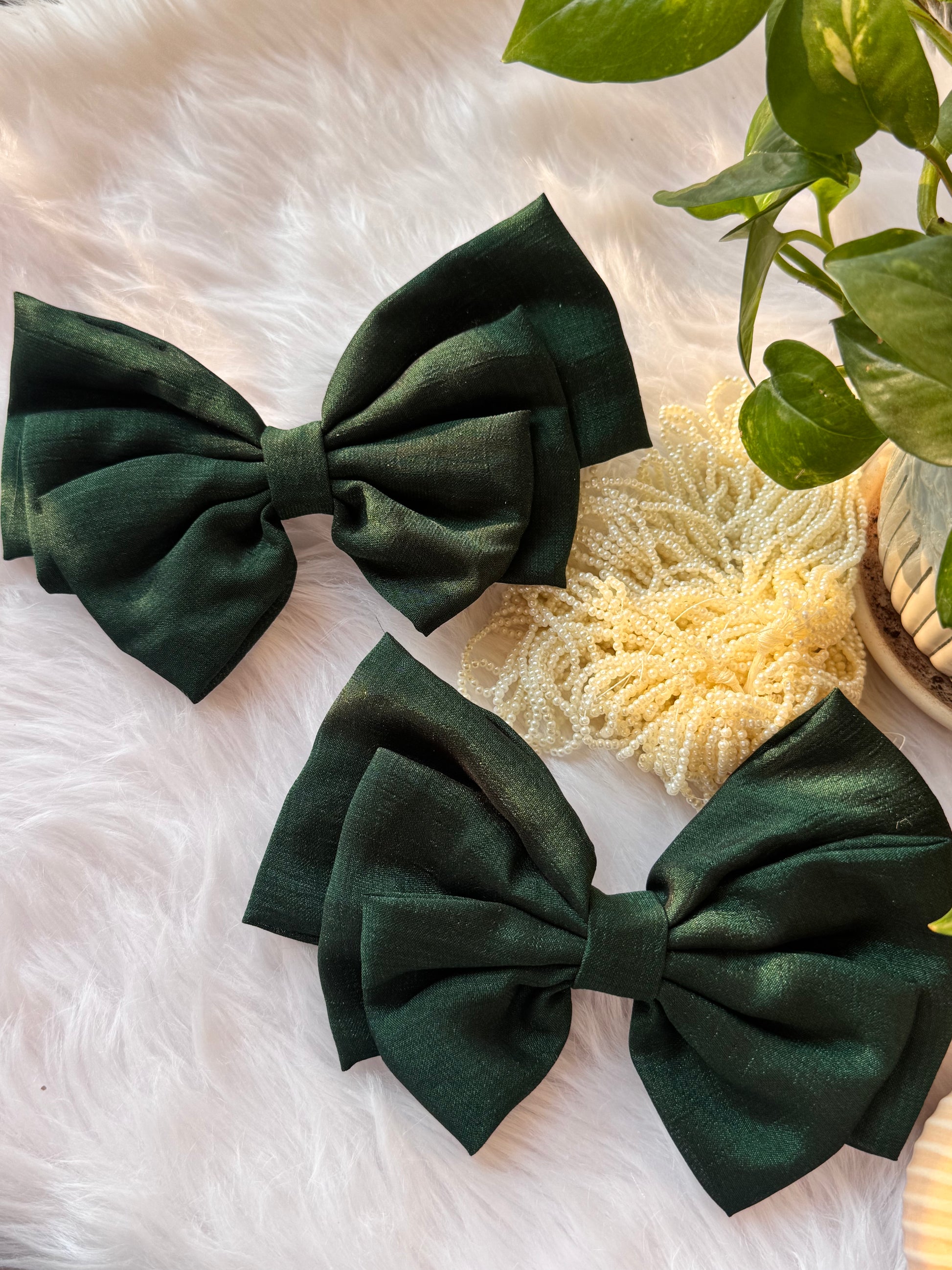 Collection of Forrest Green Vichitra Silk Hair Bows – elegant bottle green hair accessories neatly arranged front-facing.