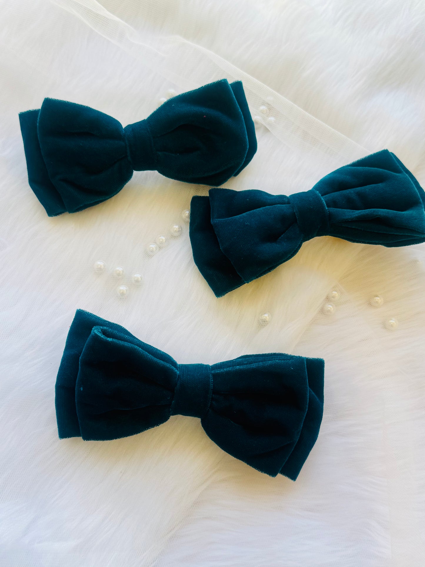 Three Blueberry Pie Hair Bows - Front view of a set of peacock blue premium velvet hair bow clips, ideal for adding bold elegance to any look.