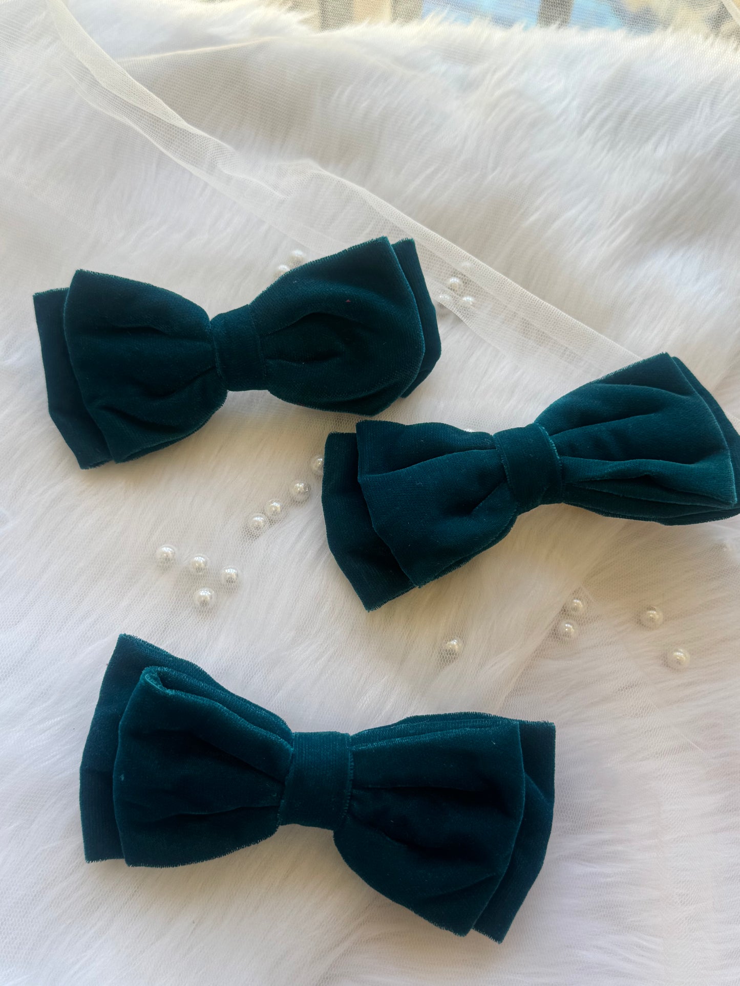 Three Blueberry Pie Hair Bows - Front view of a set of peacock blue premium velvet hair bow clips, ideal for adding bold elegance to any look.