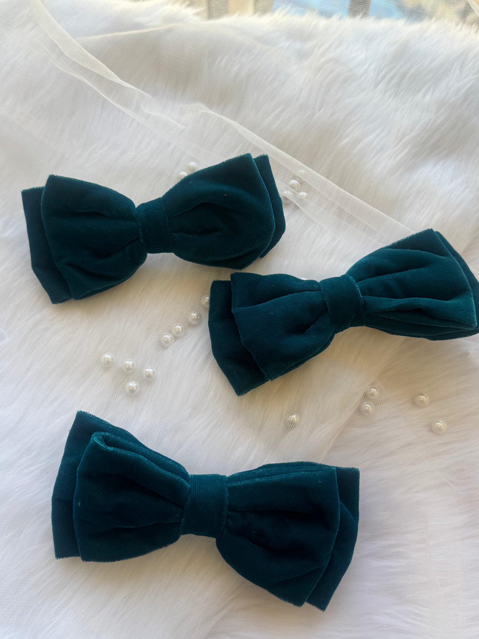 Three Blueberry Pie Hair Bows - Front view of a set of peacock blue premium velvet hair bow clips, ideal for adding bold elegance to any look.