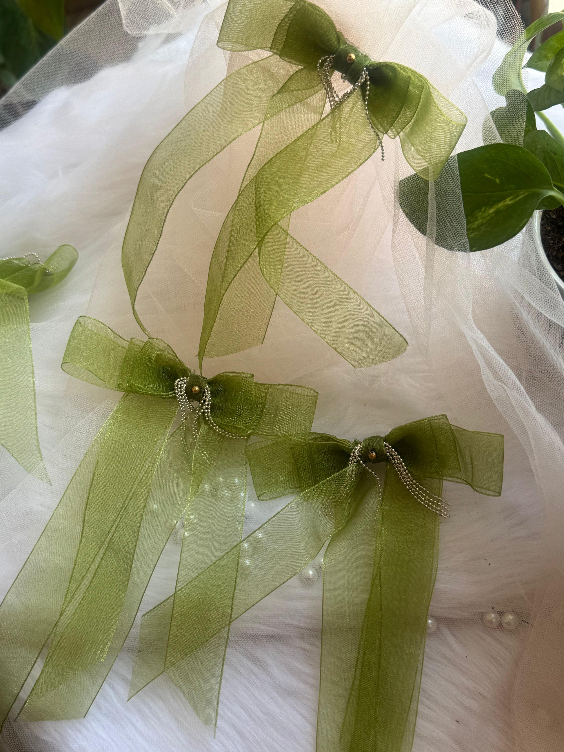 Three Tinker Bell Hair Bows - Front view of a set of light green organza hair bow clips with silver chain accents, perfect for sophisticated and versatile styling.