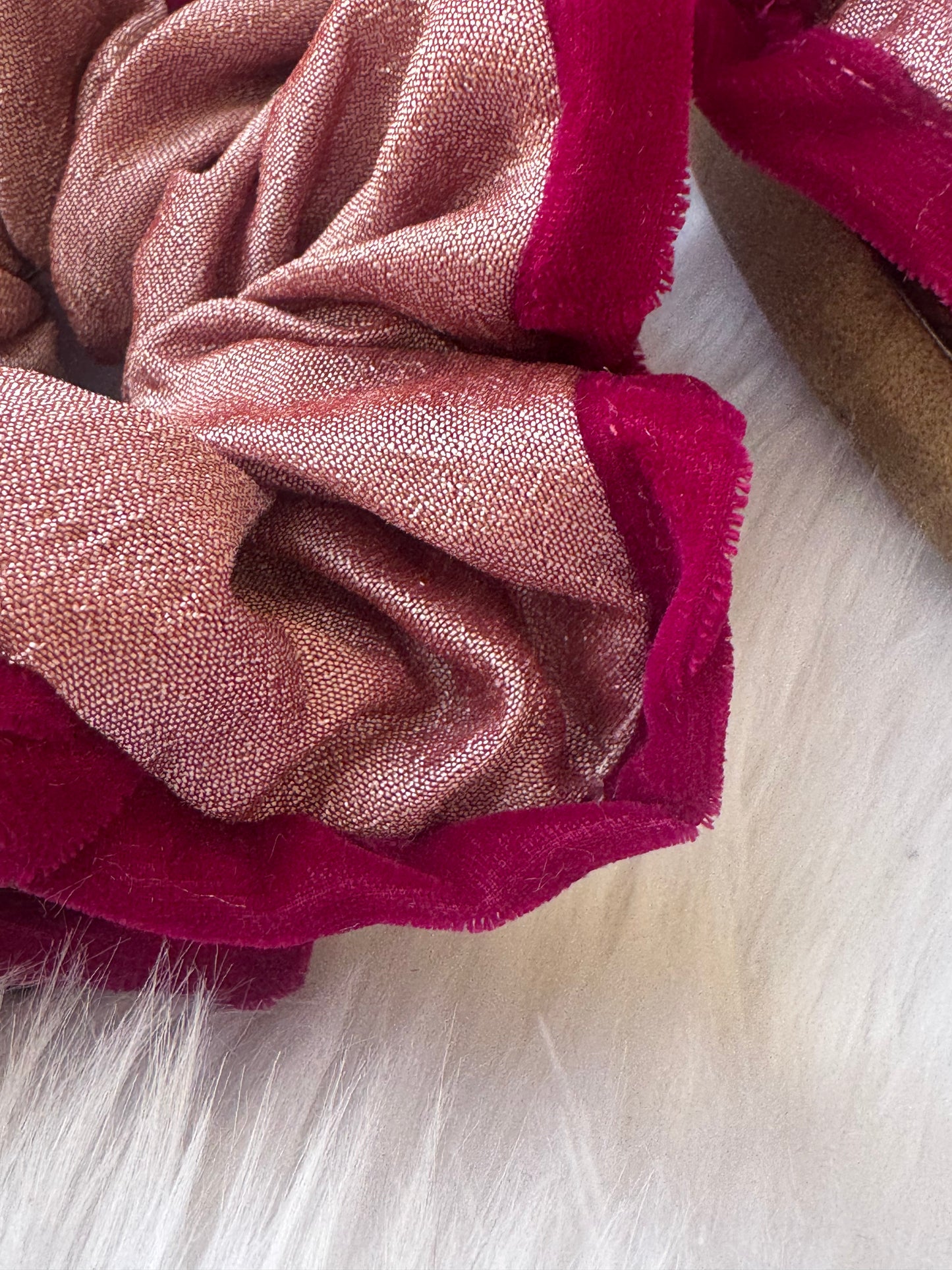 Close-up image of the Damask Roses Scrunchie, showcasing its smooth silk fabric, plush deep pink velvet border, and secure elastic band