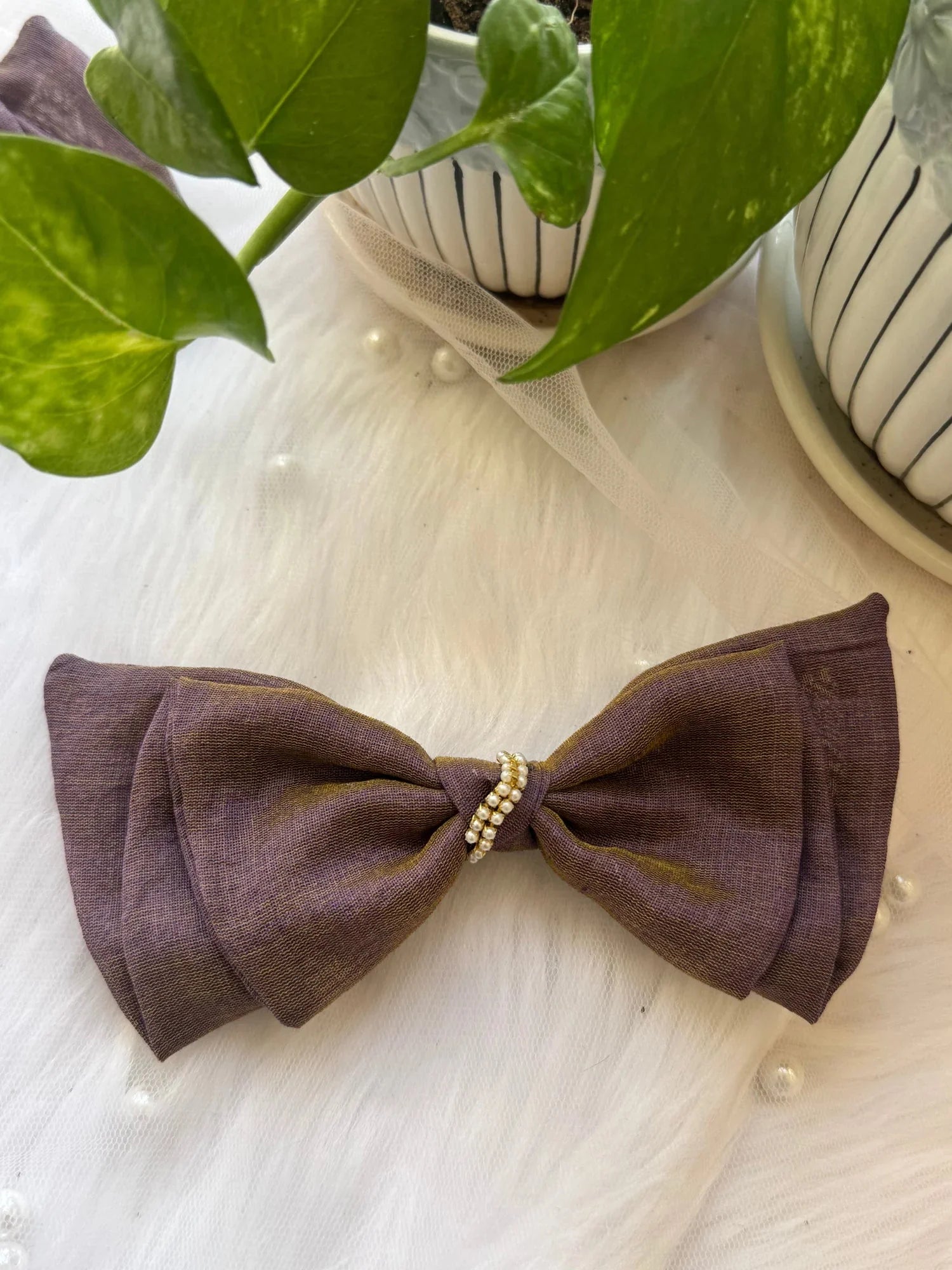 Blackcurrant Ice dual-tone cotton hair bow with pearl detail by Bows and Bags India, handmade accessory on wooden surface