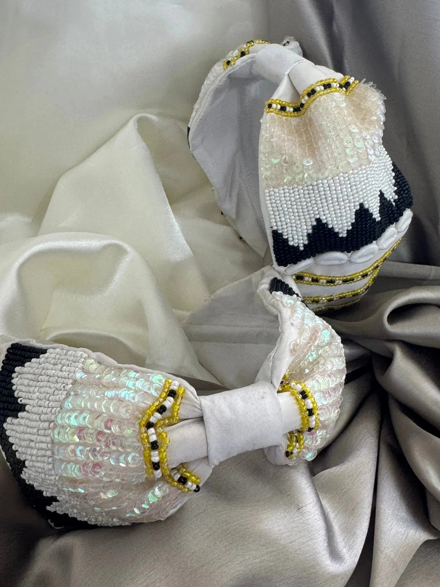 Boho Bling white satin handmade headband with iridescent sequins and gold beading detail, lifestyle shot on model by Bows