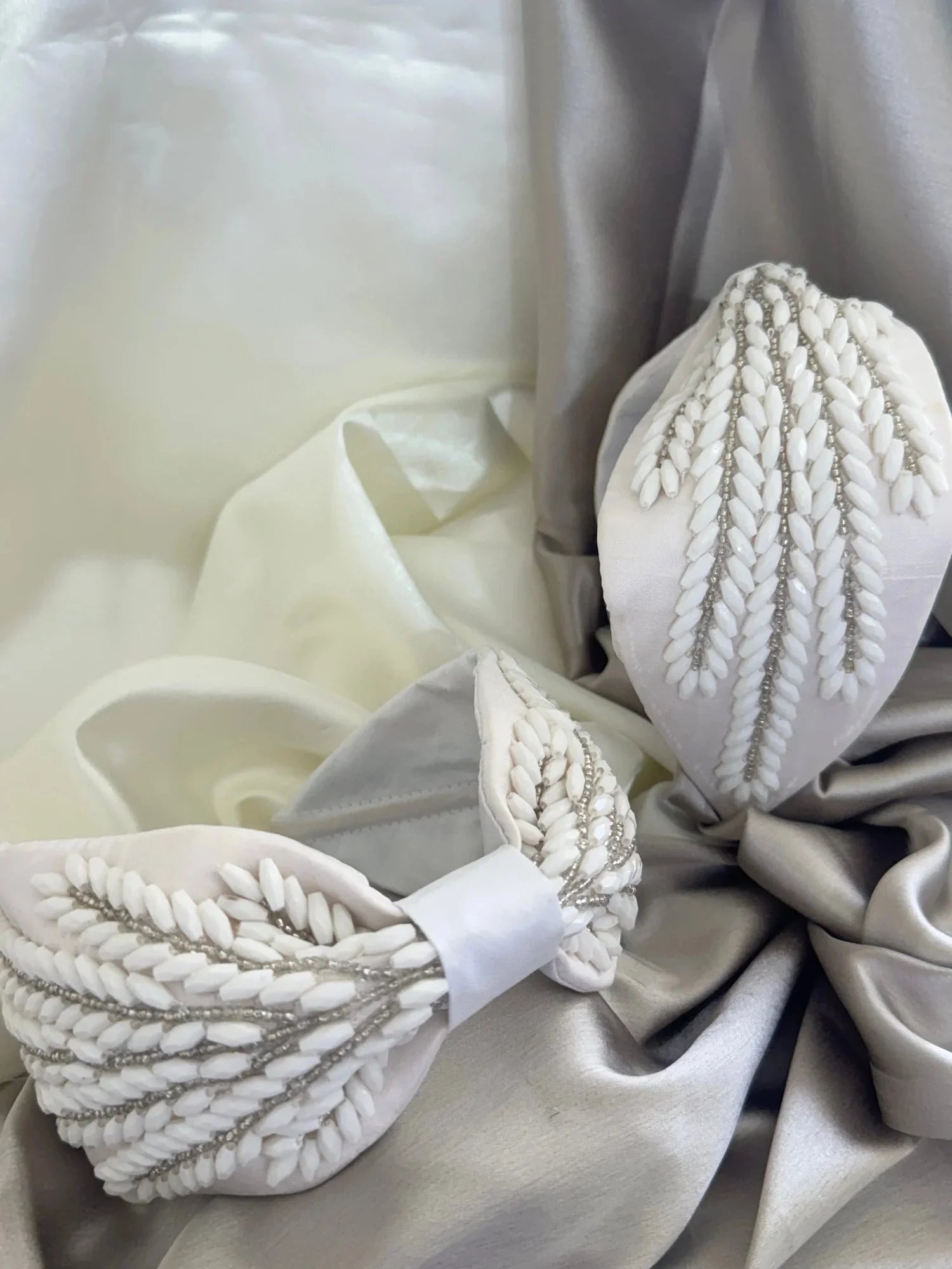 Handmade beaded satin headband with intricate leaf embellishments, white and grey fabric detail by Bows and Bags India