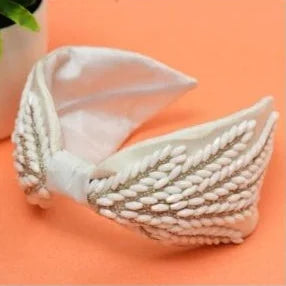 Coral Jewel handmade beaded satin headband detail by Bows and Bags India, white satin with intricate leaf beadwork texture