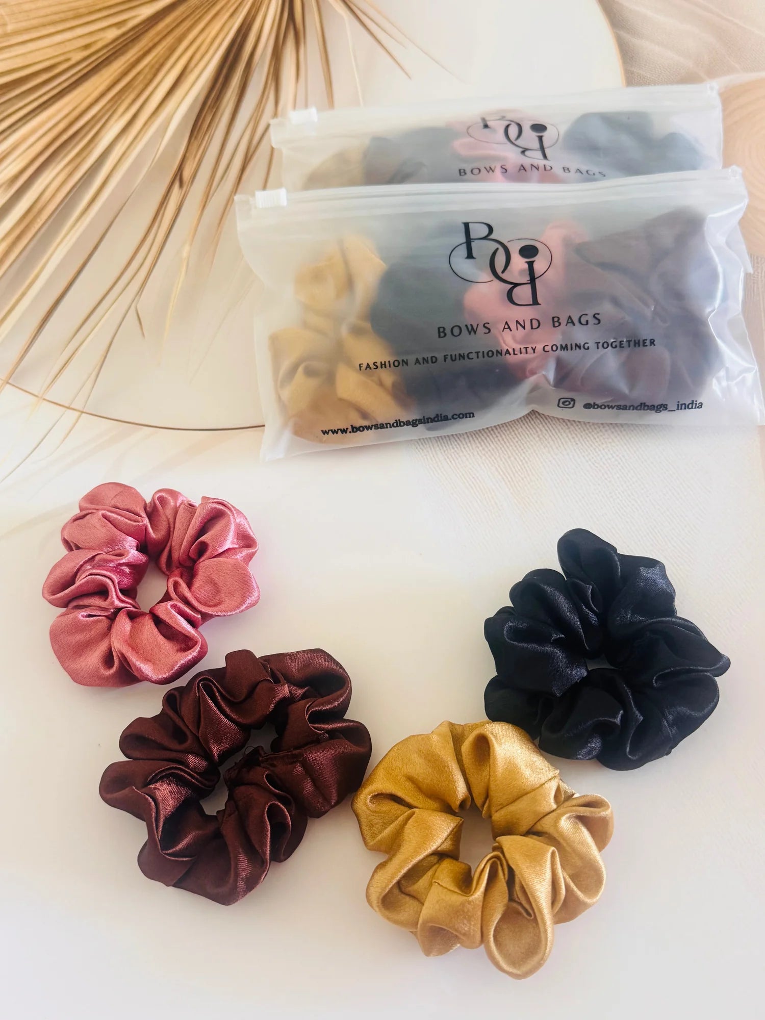 Pack of 4 satin scrunchies in black, gold, rust, and burgundy by Bows and Bags India handmade hair accessories