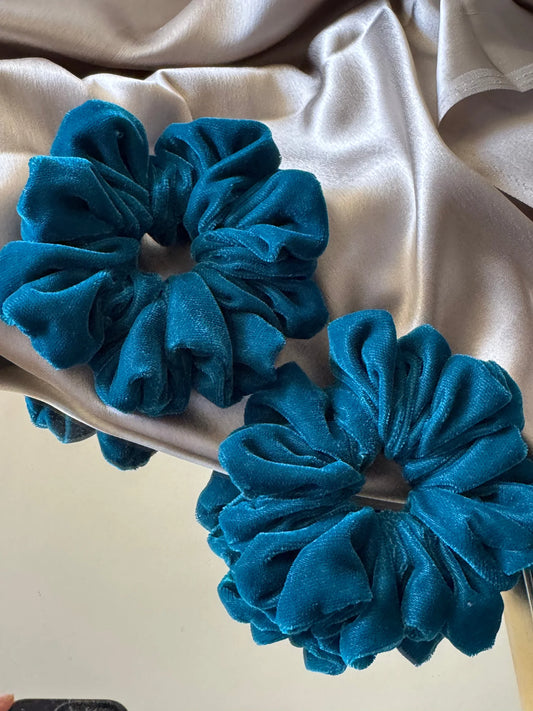 Teal blue luxe velvet scrunchies from Bows and Bags India displayed on cream fabric, showing premium handmade hair