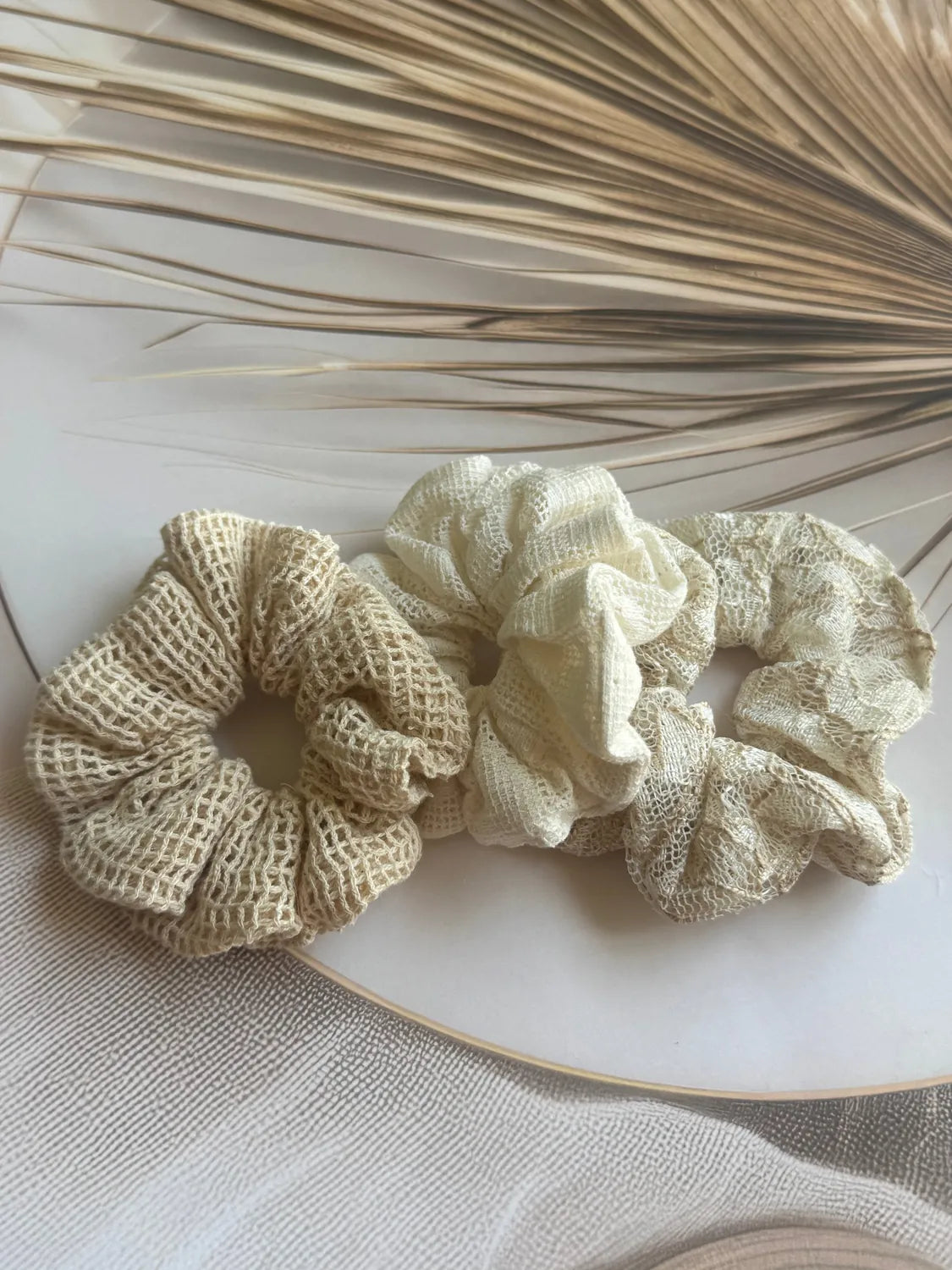 Three handmade net mesh scrunchies in cream and beige tones, Dune Trio set by Bows and Bags India, displayed on white
