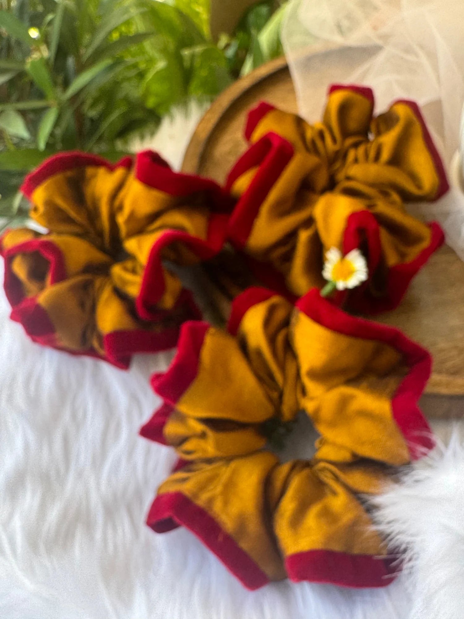 Golden yellow silk scrunchie with maroon velvet detailing by Bows and Bags India, handmade hair accessory displayed on white