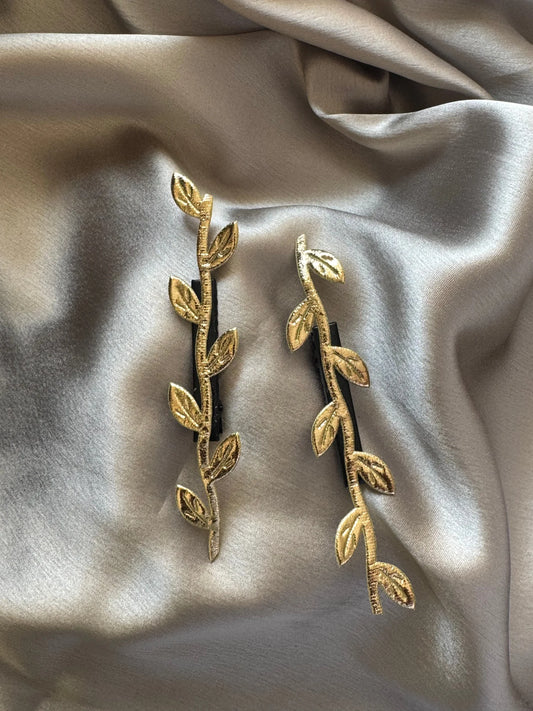 Golden Twig hair clips pair on cream silk fabric, handmade gold leaf design by Bows and Bags India