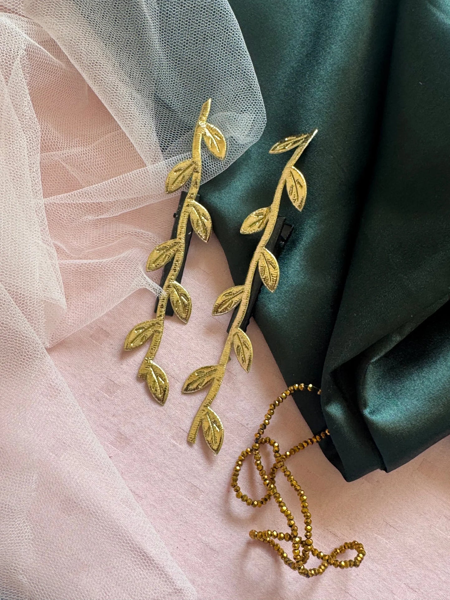 Golden Twig hair clips by Bows and Bags India paired with blush pink and forest green fabrics, handmade gold leaf details