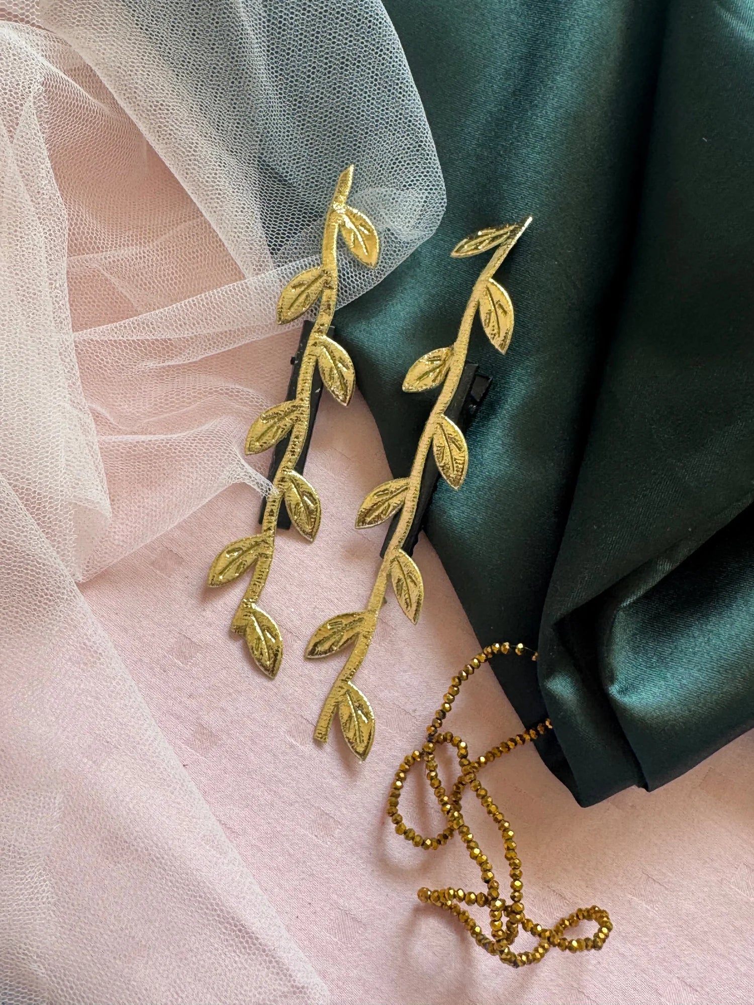 Golden Twig hair clips by Bows and Bags India paired with blush pink and forest green fabrics, handmade gold leaf details