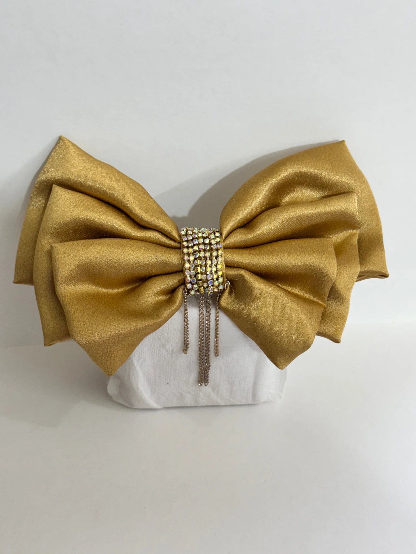 Goldy Bling stone studded golden hair bow with satin finish and chain embellishments by Bows and Bags India, displayed on