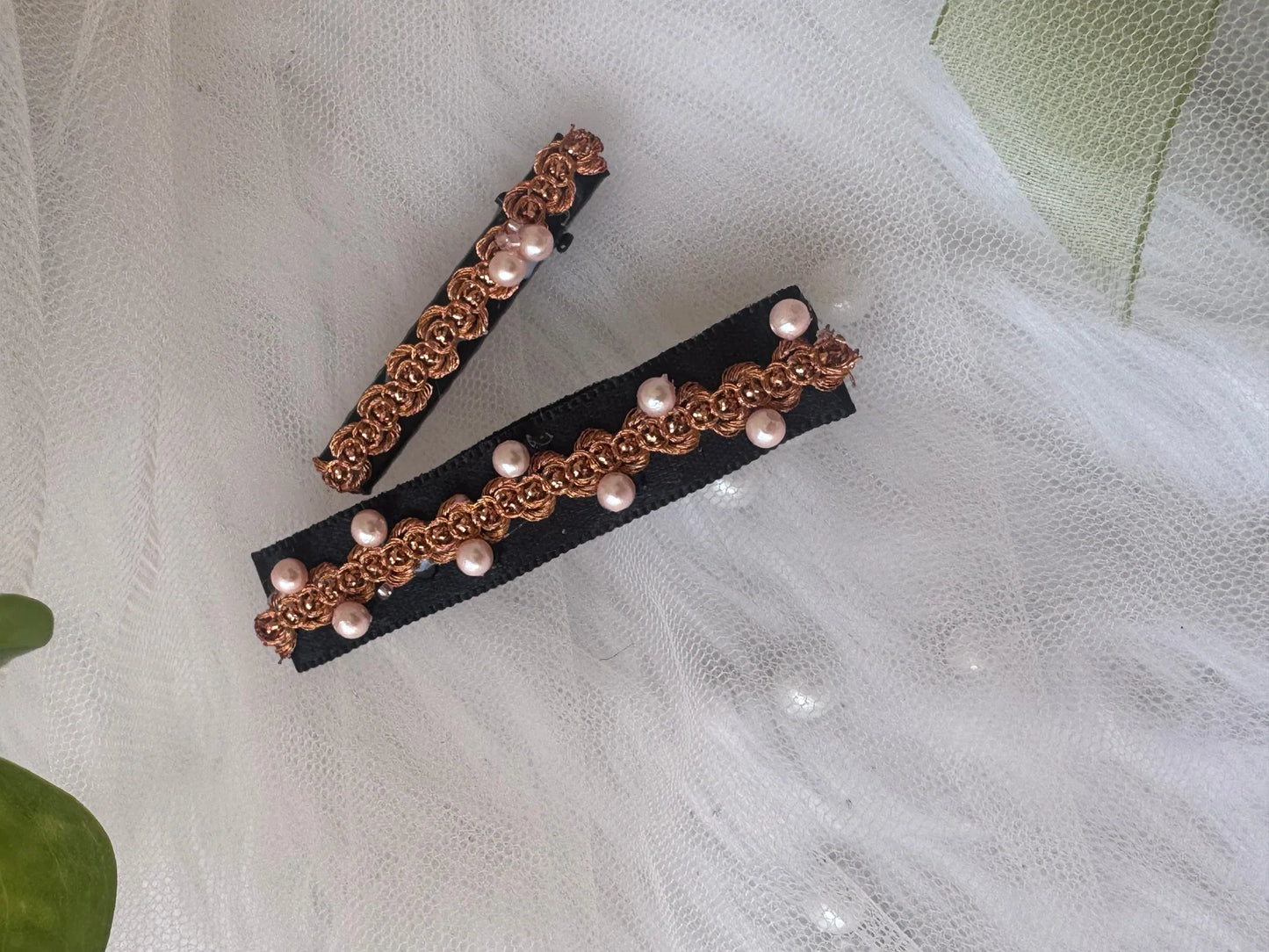 Pearl embroidered hair clips with golden filigree design by Bows and Bags India, handmade accessories displayed on white