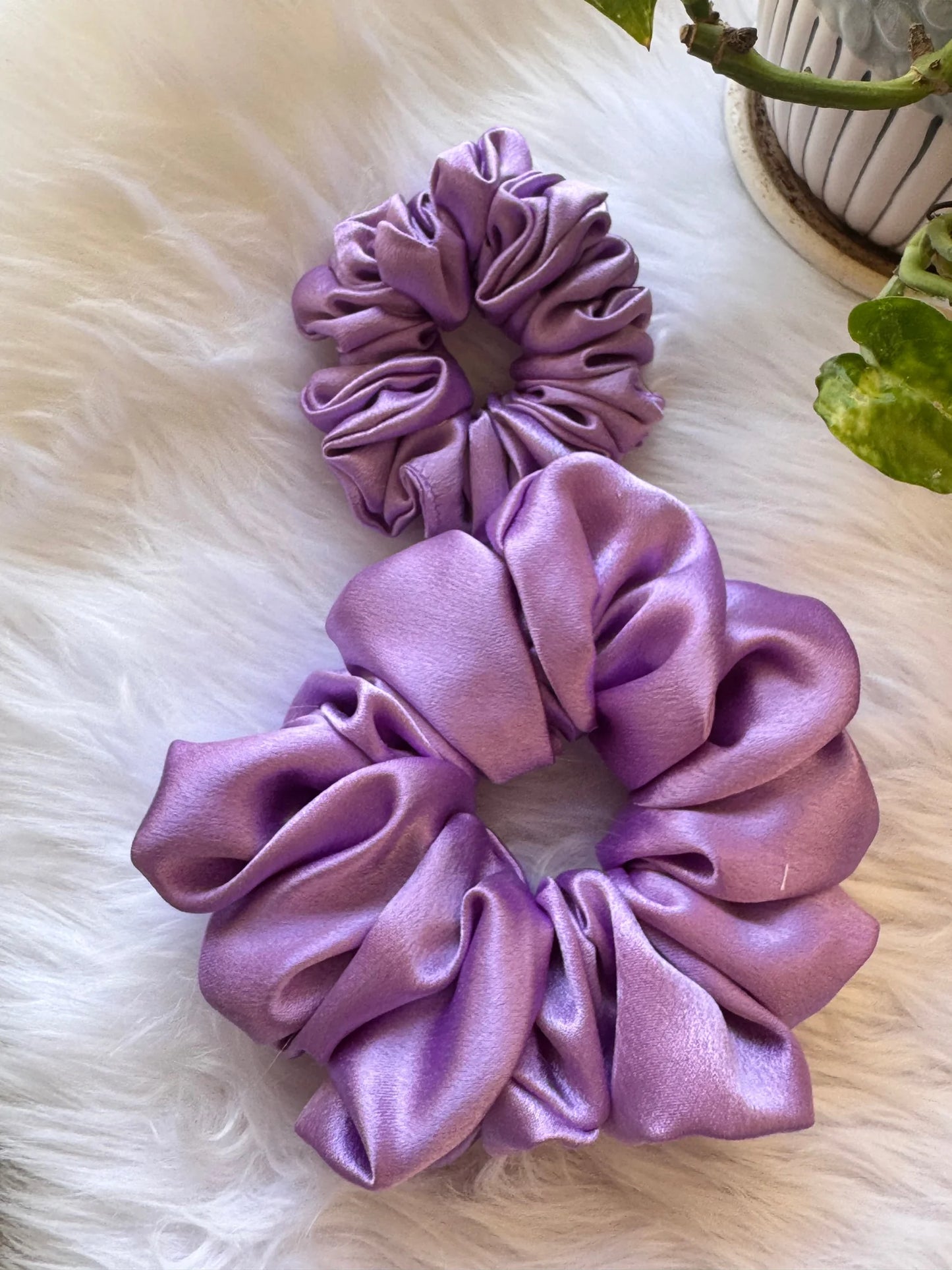 Lavender Duo satin scrunchies combo by Bows and Bags India showing large and small handmade hair accessories on white fur