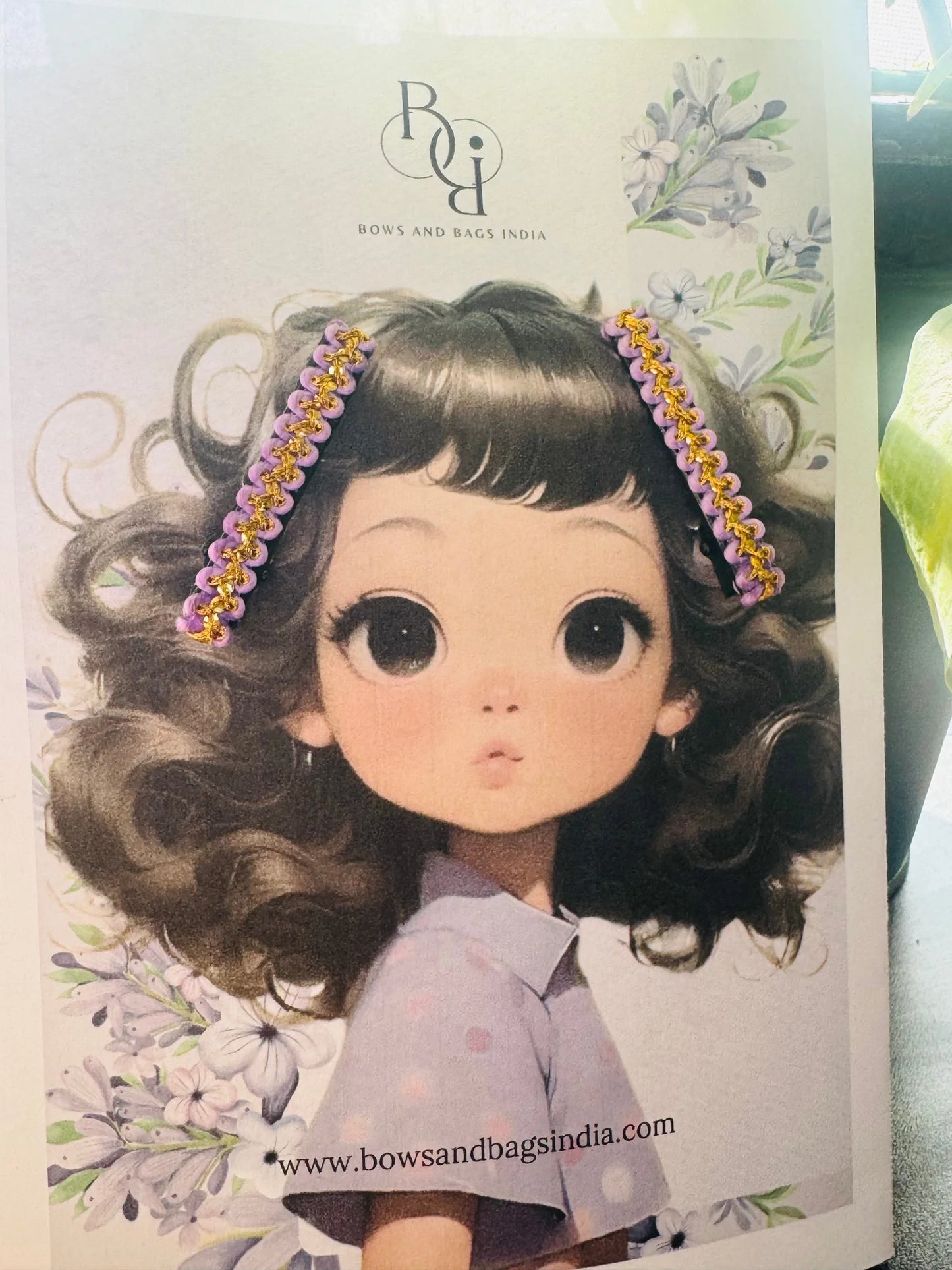 Lavender Paddy hair clip packaging by Bows and Bags India featuring illustrated girl with floral aesthetic design