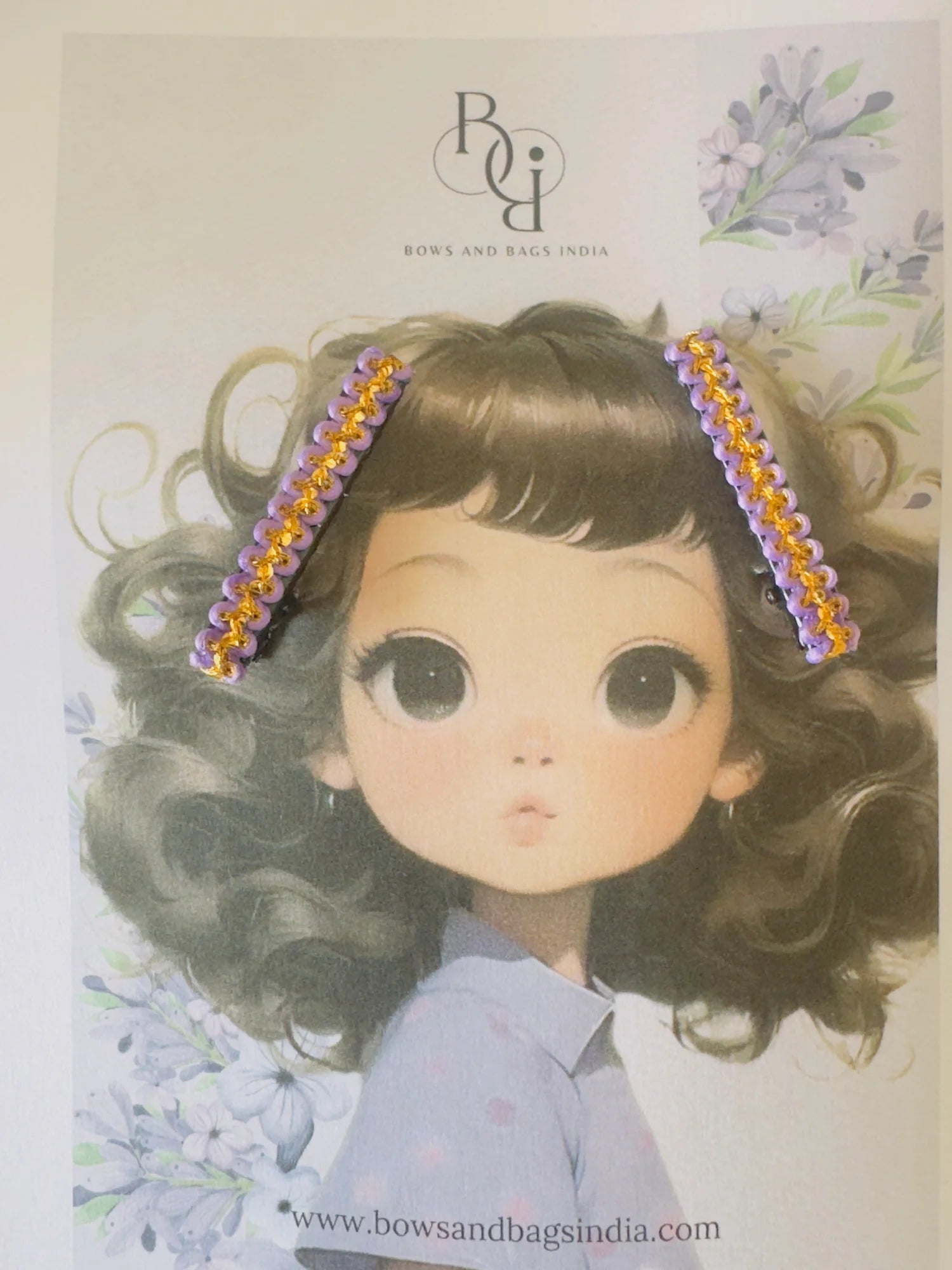 Lavender Paddy hair clip with gold beaded trim on illustrated girl model by Bows and Bags India