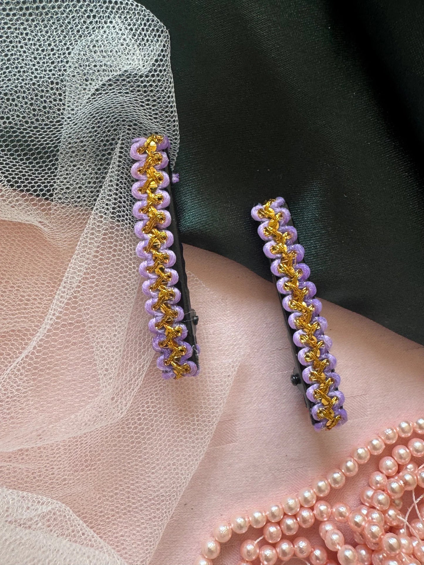 Lavender Paddy hair clips with gold beading worn as a matching pair on model, handmade accessory by Bows and Bags India