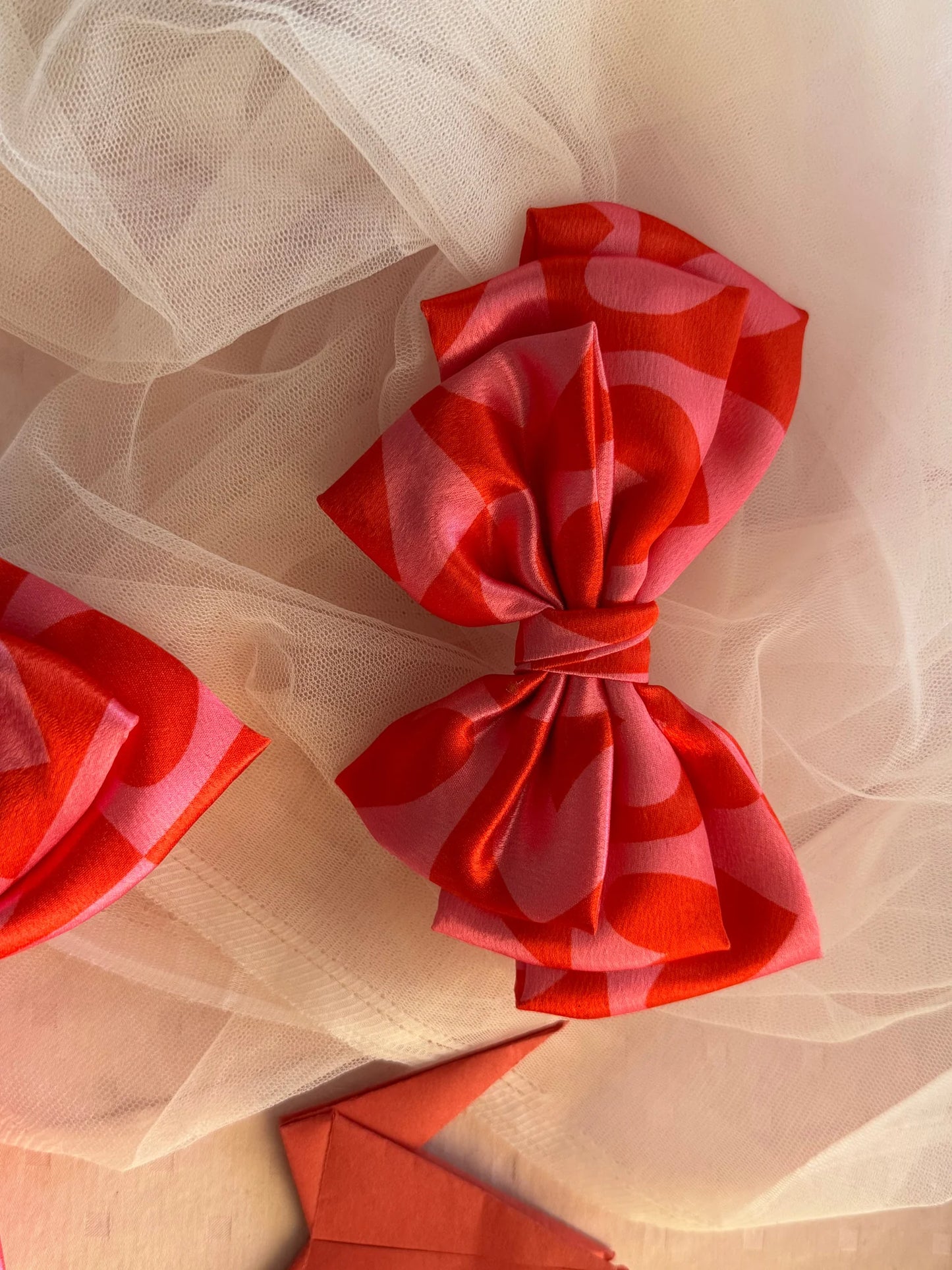 Love Struck printed satin hair bow in pink with heart details by Bows and Bags India, handmade accessory on tulle fabric