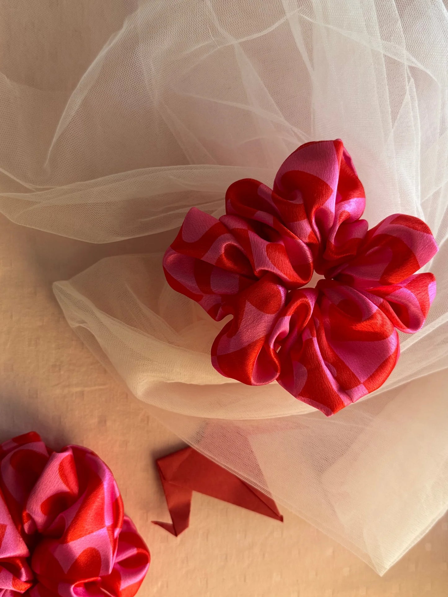 Love Stuck satin scrunchie with pink heart print on tulle background by Bows and Bags India, handmade hair accessory detail