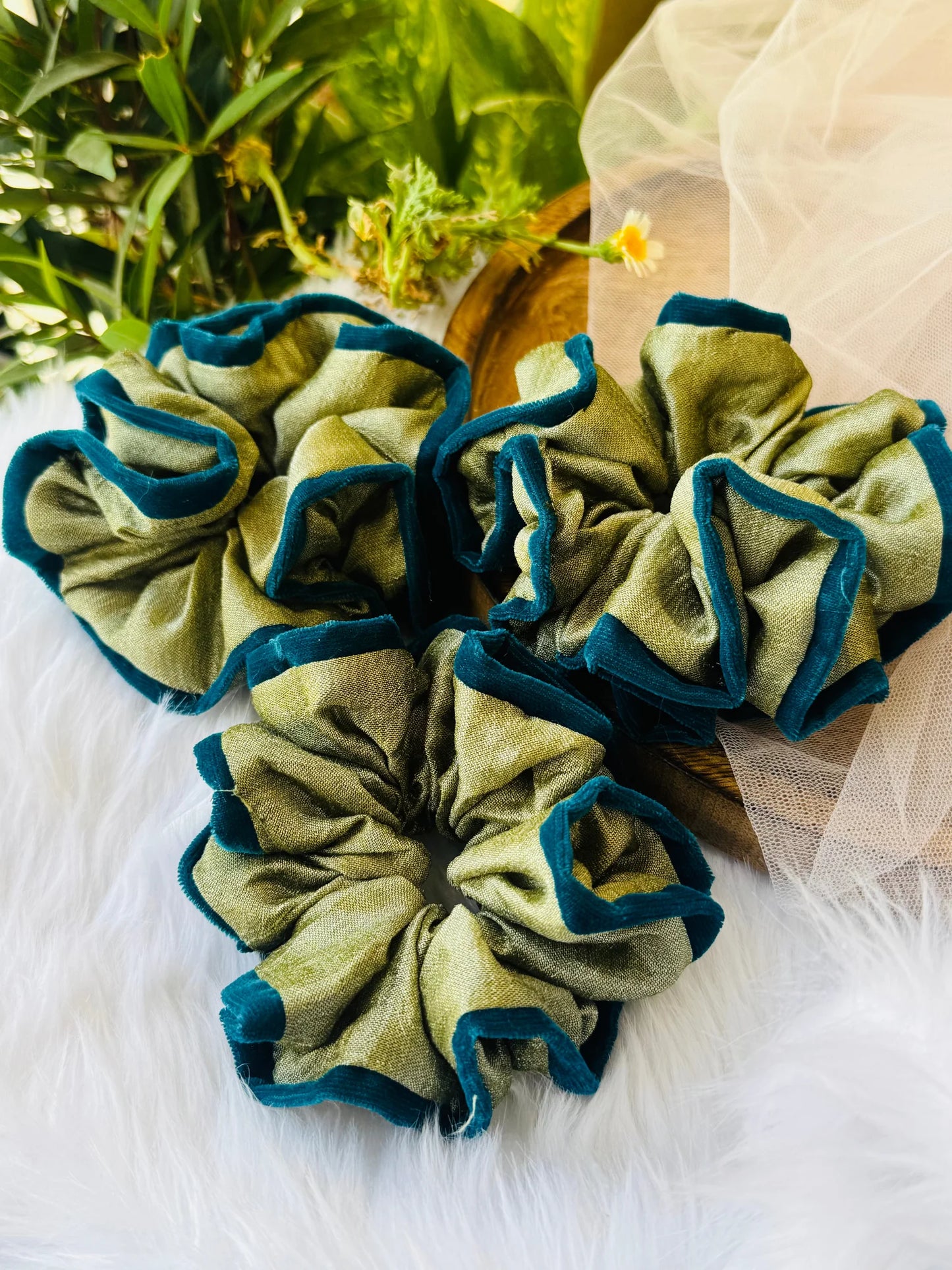Mint green silk and velvet handmade scrunchies with dark teal trim, arranged in flat lay by Bows and Bags India