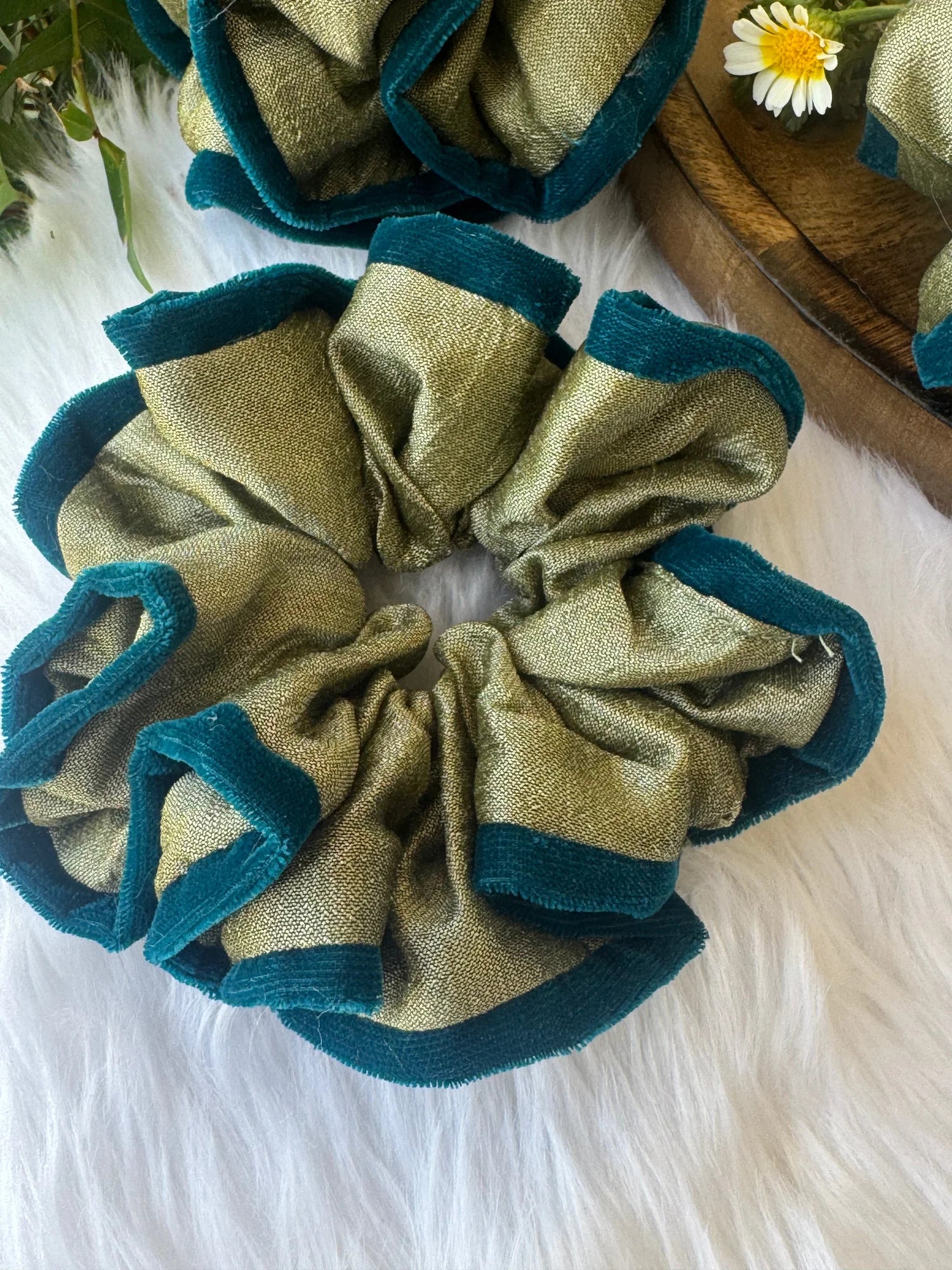 Handmade mint green silk and velvet scrunchie with teal border displayed flat lay on white fabric, Bows and Bags India