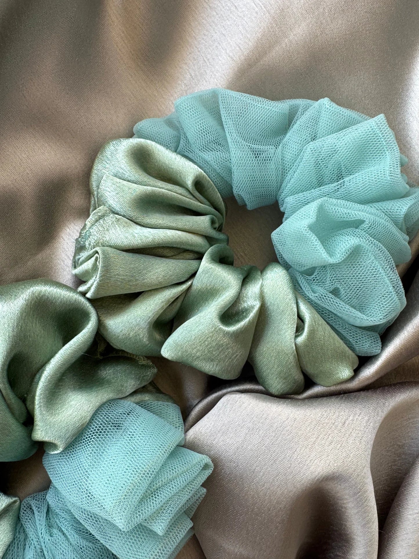 Mint green satin and net scrunchies in large size by Bows and Bags India, handmade hair accessories displayed on neutral