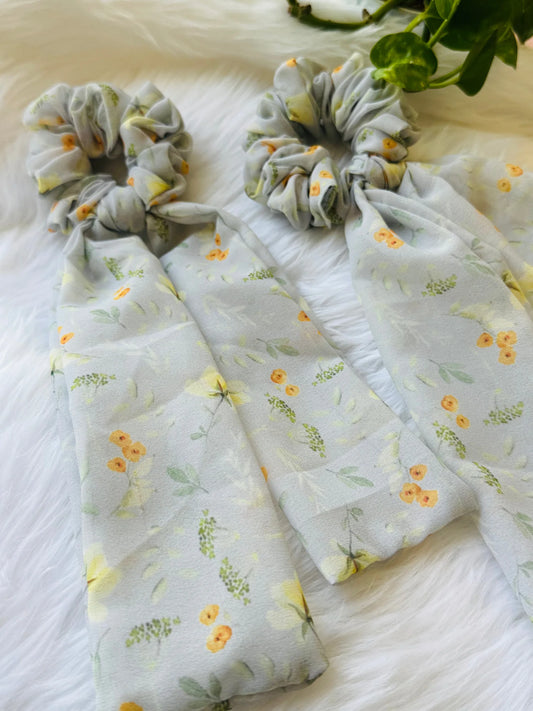 Light green floral georgette tail scrunchies with yellow and green printed flowers, handmade hair accessories by Bows and