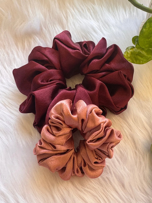 Dark fuchsia and peach satin scrunchies duo by Bows and Bags India, handmade hair accessories displayed on white textured