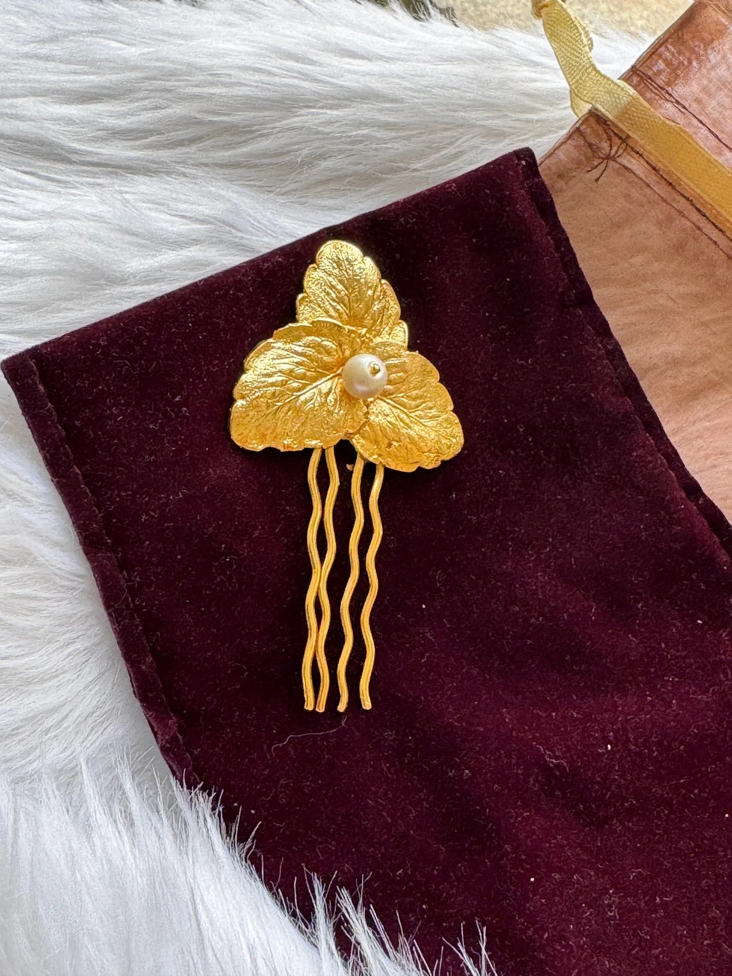 Pearl Golden Leaf hair pin on burgundy velvet by Bows and Bags India, gold leaf design with pearl detail and wavy metal