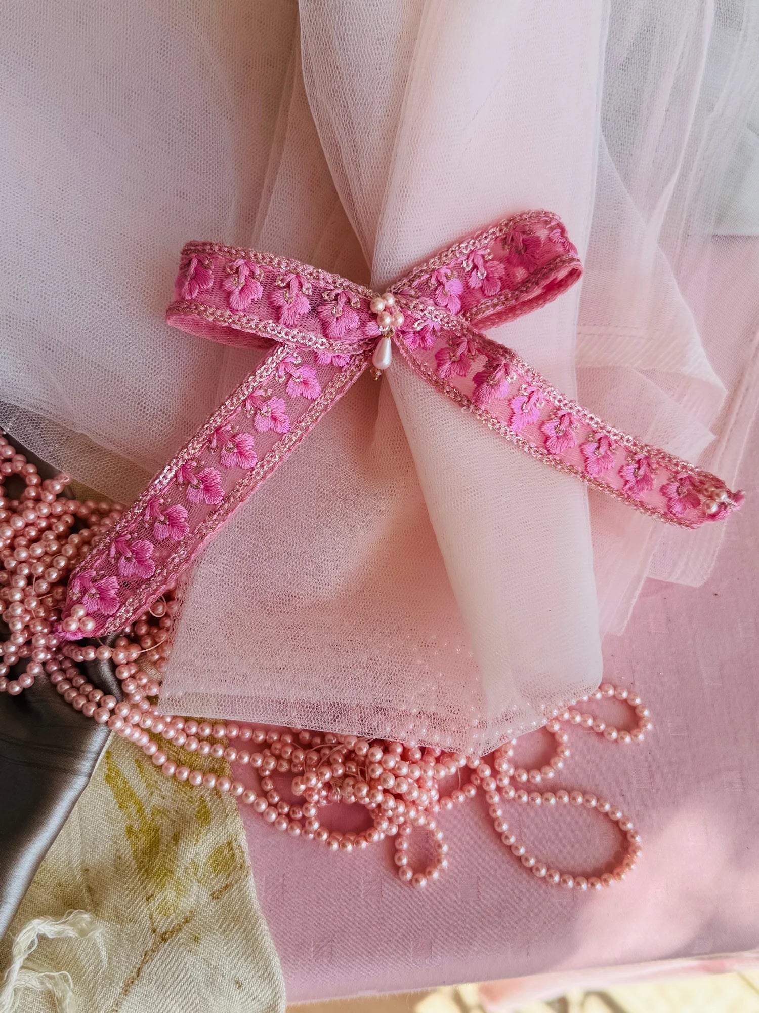 Pink pearl flower hair clip with embroidered floral detail and pearl beads, paired styling from Bows and Bags India handmade
