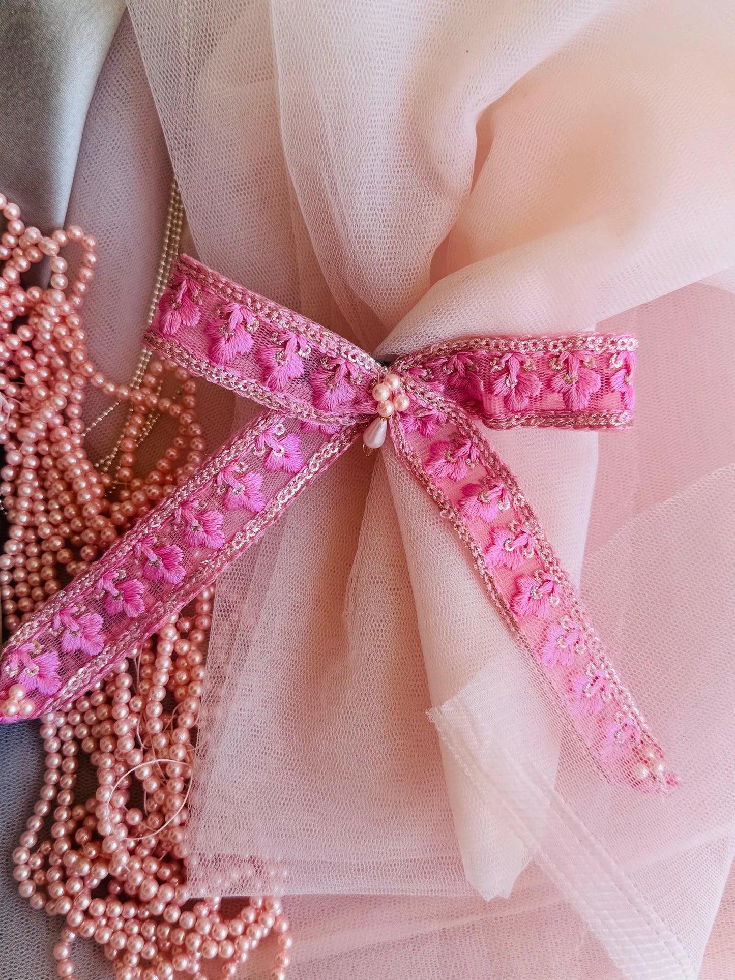 Pink Pearl Flower hair clip with embroidered floral design and pearl beads on tulle fabric by Bows and Bags India