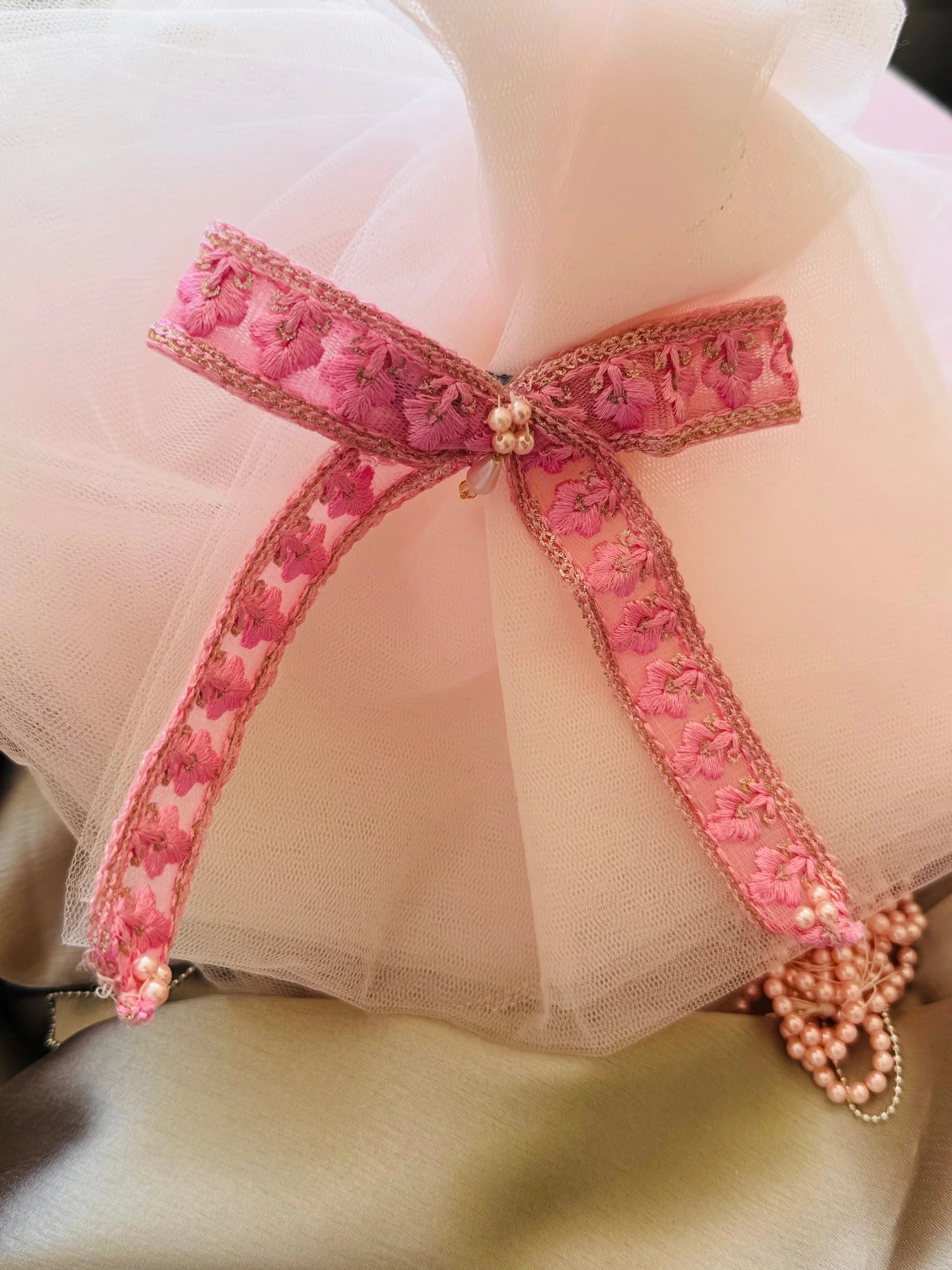 Pink Pearl Flower hair clip with embroidered floral design and pearl center, paired styling by Bows and Bags India