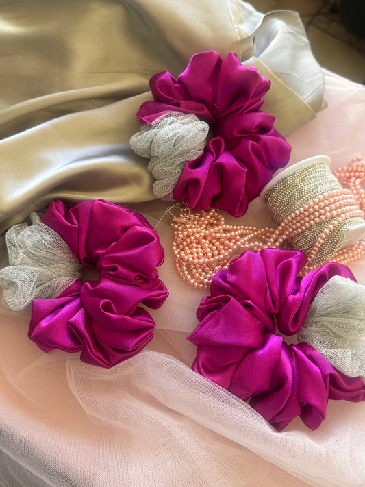 Three vibrant pink satin scrunchies with silver net detail from Bows and Bags India, handmade hair accessories displayed on