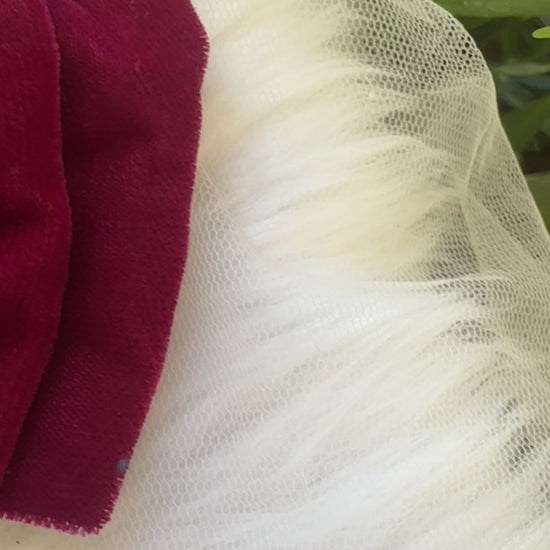 Close-up video of the Runaway Diva Hair Bow Clip, showcasing its rich magenta pink premium velvet fabric for a bold and luxurious design.