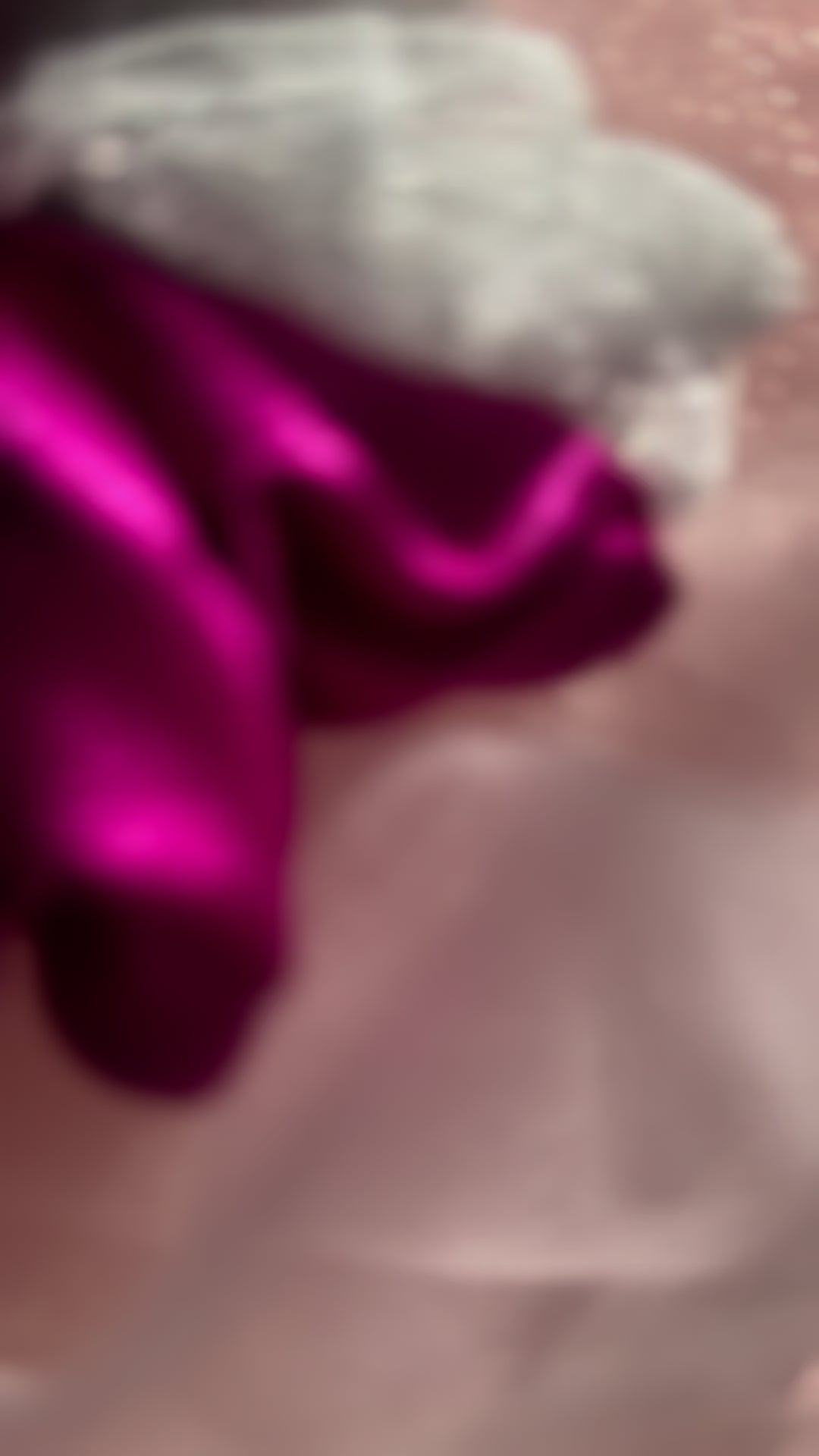 Close-up video of the Pink Silver Snow Scrunchie, highlighting its soft satin fabric, shimmering silver net detailing, and strong yet gentle elastic band.