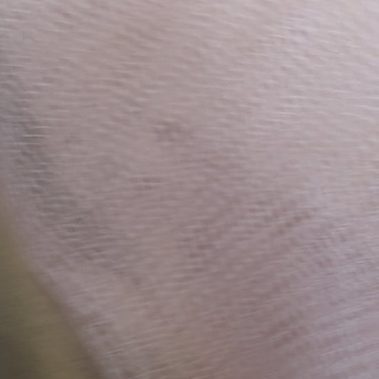 Close-up video of the Terracotta Flower Scrunchie, showcasing its soft satin texture, warm earthy tones, and strong yet gentle elastic band