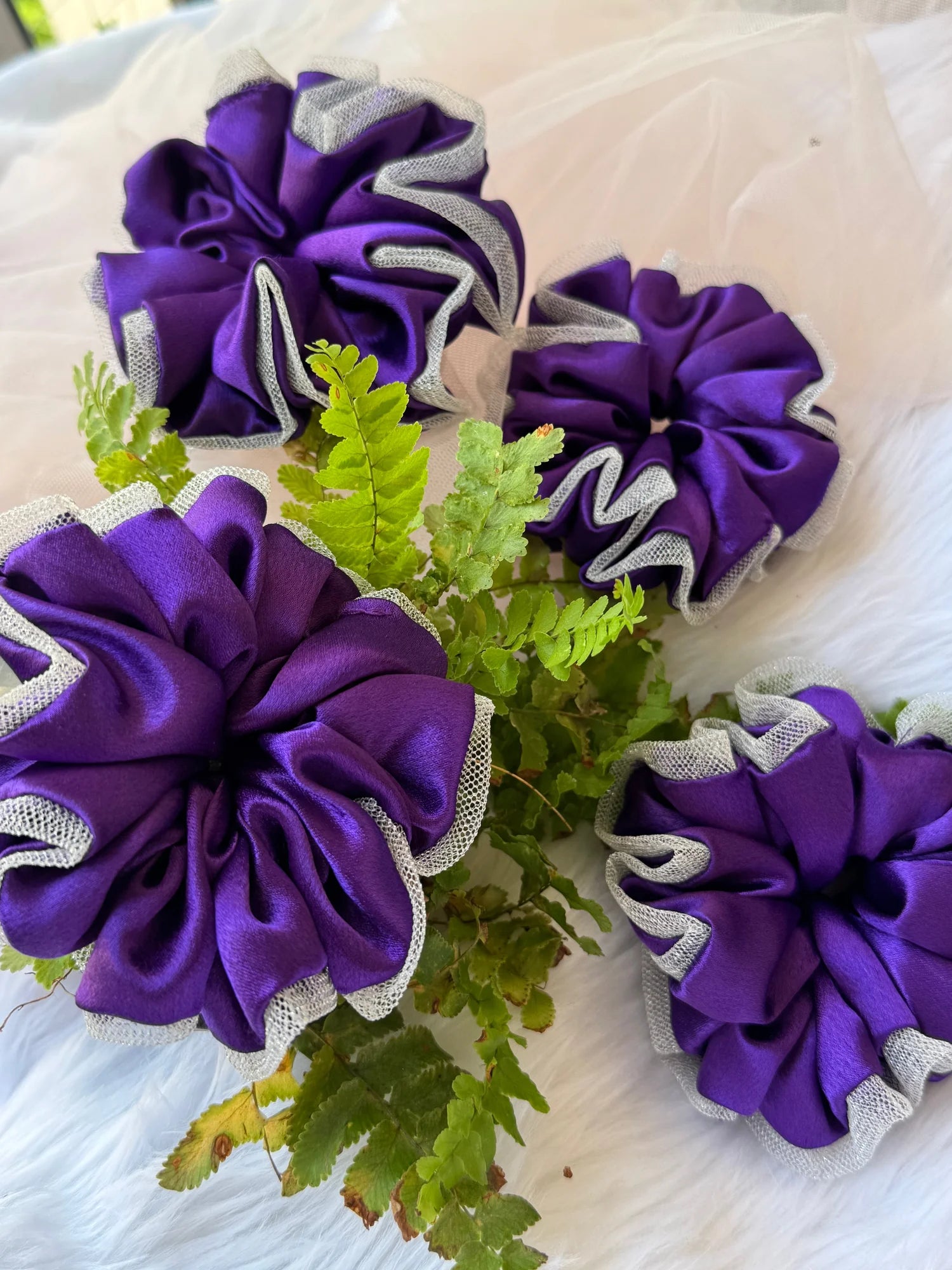 Purple satin scrunchie with silver net border by Bows and Bags India, handmade hair accessory with green fern details on
